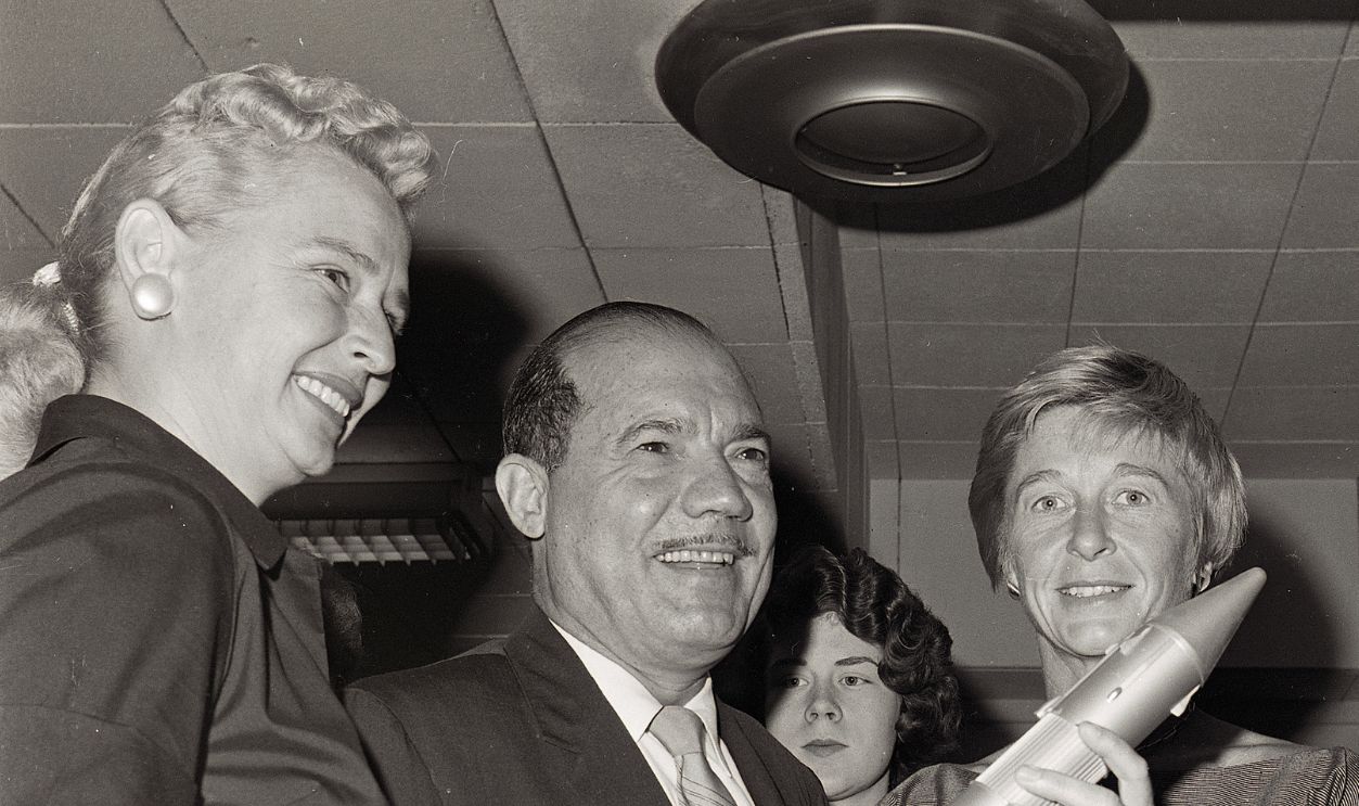 Rep. Victor Anfuso (D-NY), Subcommittee Chairman, looks over a model of an Atlas-Centaur missile with two of the first witnesses- Jerrie Cobb (left), consultant to the National Aeronautics and Space Administration; and Mrs. Philip Hart (right) 515982148