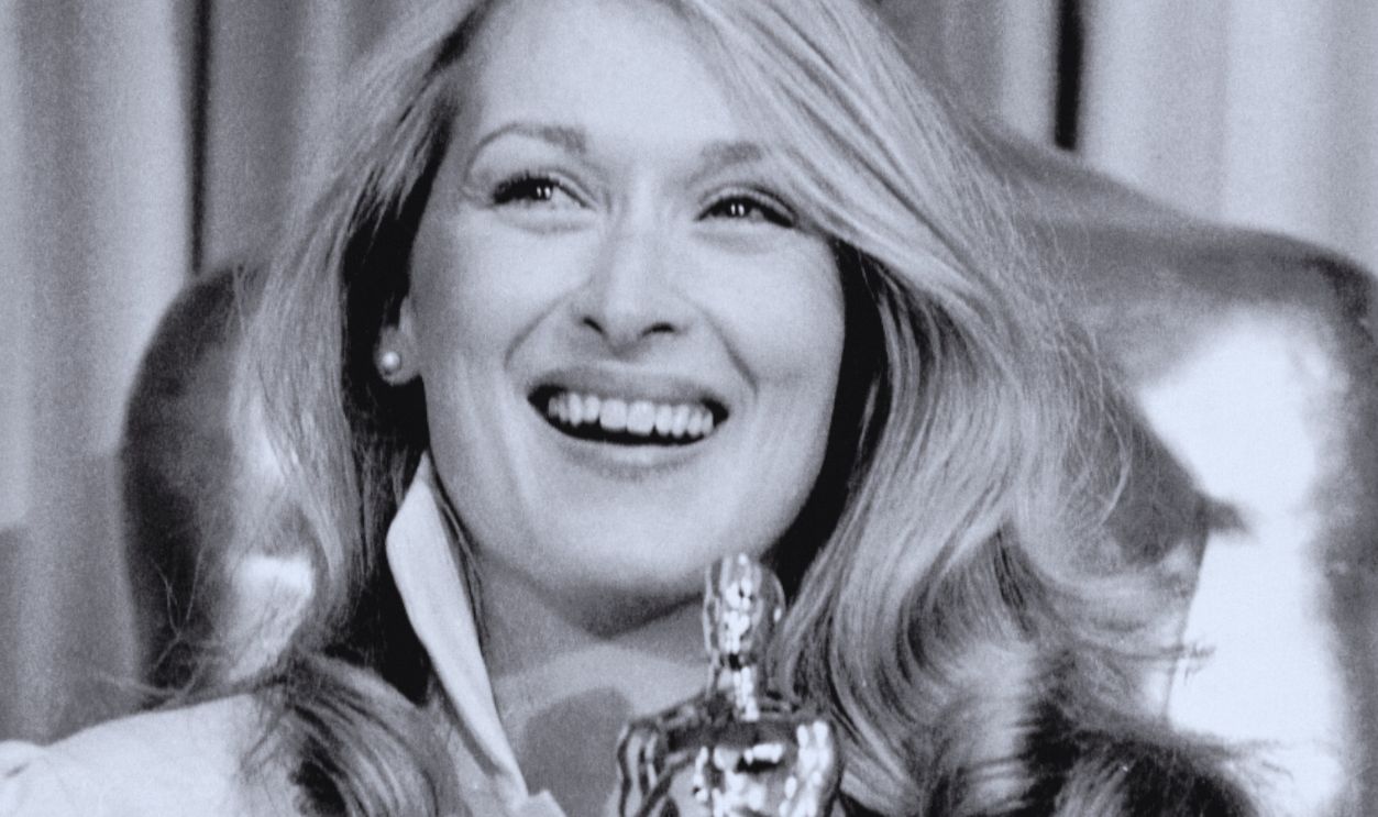 (Original Caption) Actress Meryl Streep hugs her Oscar after winning the Best Actress in a Supporting Role for her role in Kramer vs. Kramer, during the 53rd Annual Academy Awards presentations at the Music Center 4/14. She stands before a statue of the Oscar in the "deadline" room after receiving the award.
