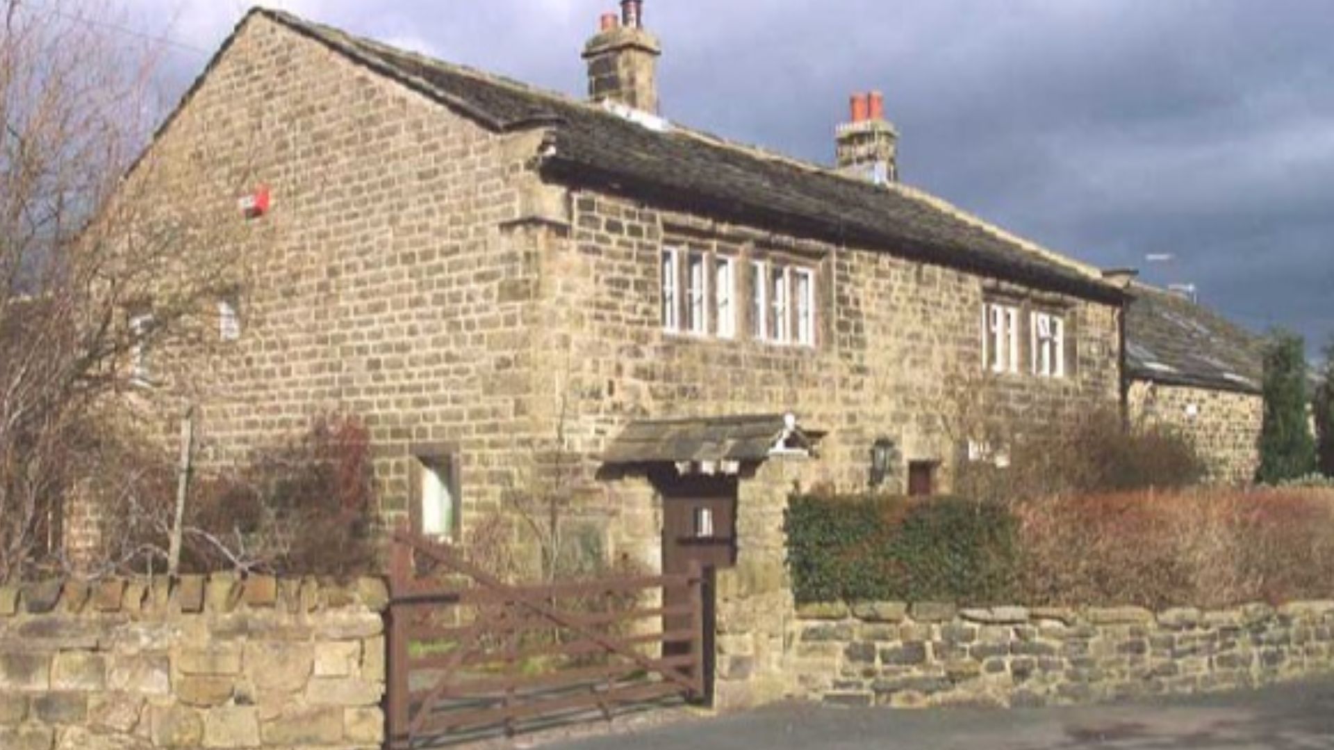 Manor Farm, Cottingley. Listed Building showing Cross of Knights of St. John