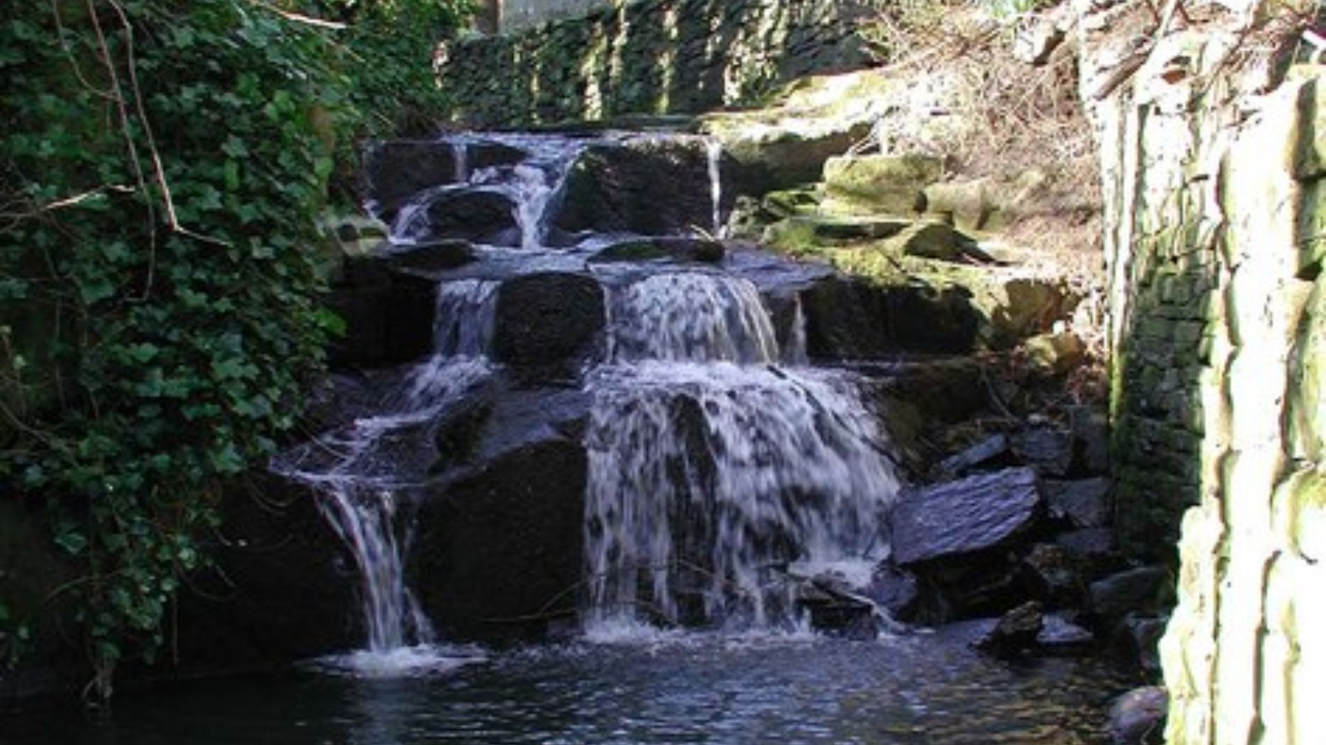 Cottingley Beck waterfall, where two young girls, Frances Griffiths and Elsie Wright, claimed to have taken a photograph of the Cottingley Fairies in 1917.