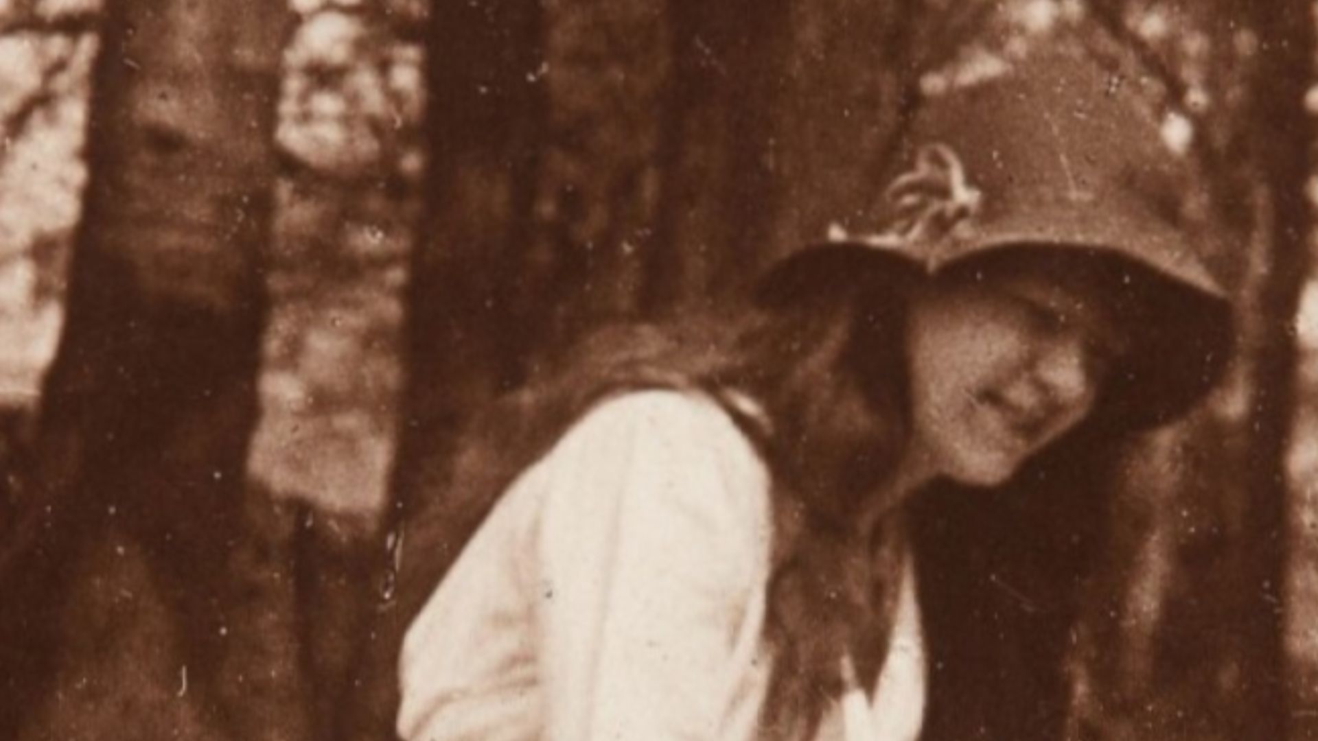 The second of the Cottingley Fairies photographs, showing Elsie Wright with a fairy