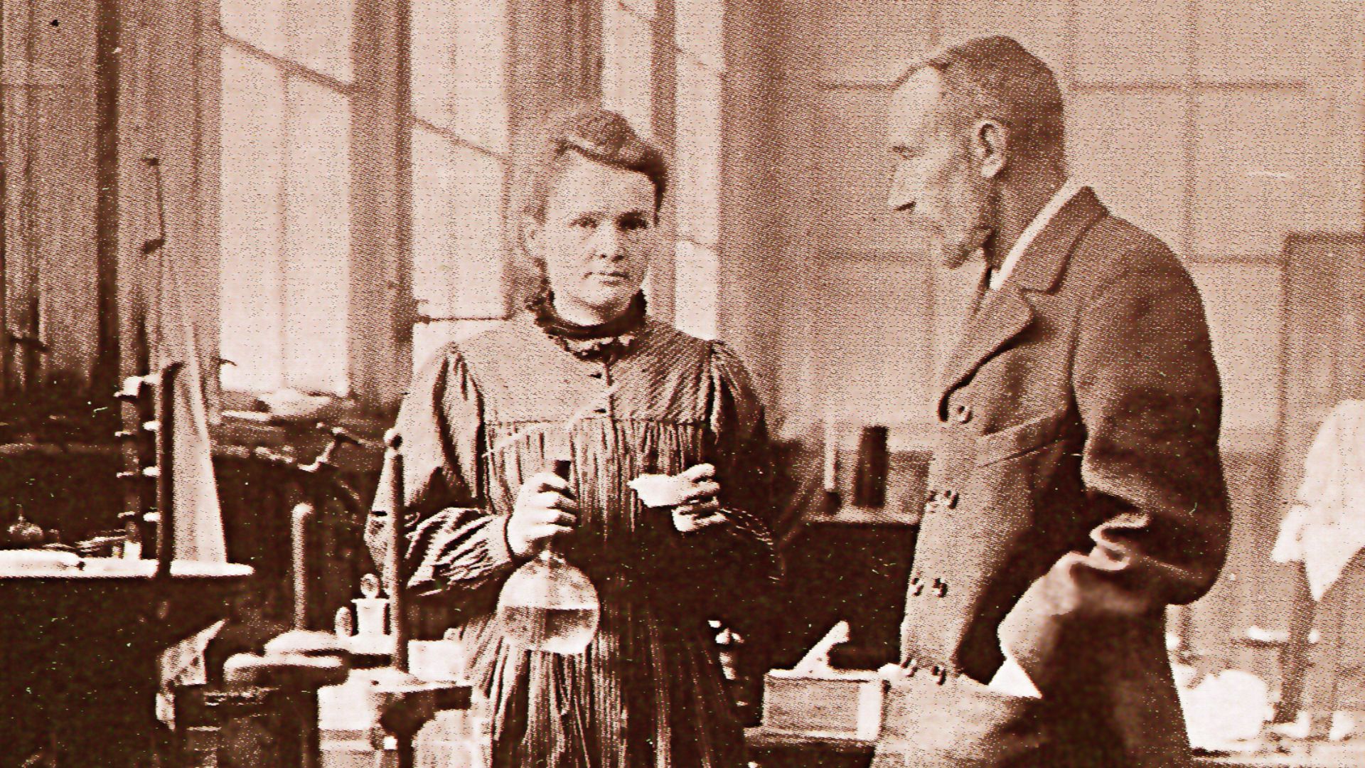 Maria Skłodowska-Curie and Pierre Curie in their laboratory in Paris.