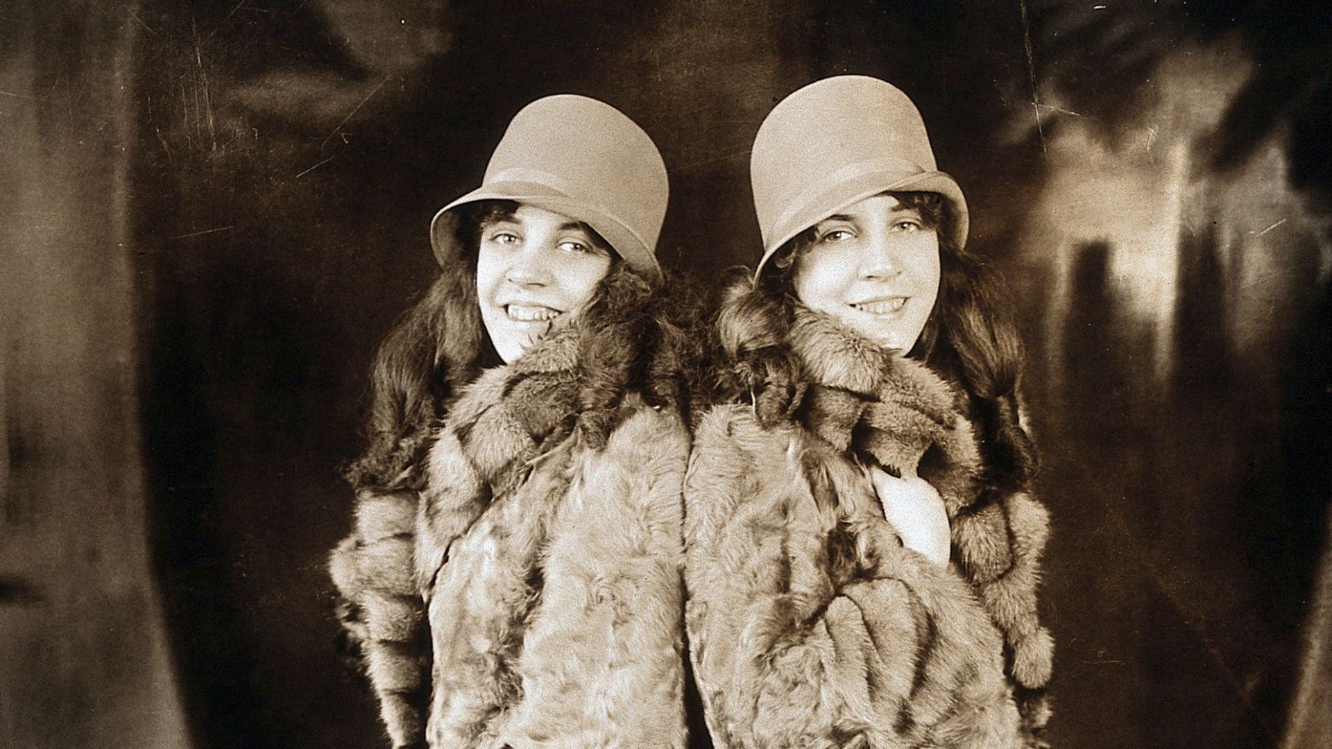 Daisy and Violet Hilton, conjoined twins, wearing fur coats. Photograph, c. 1927.

Iconographic Collections