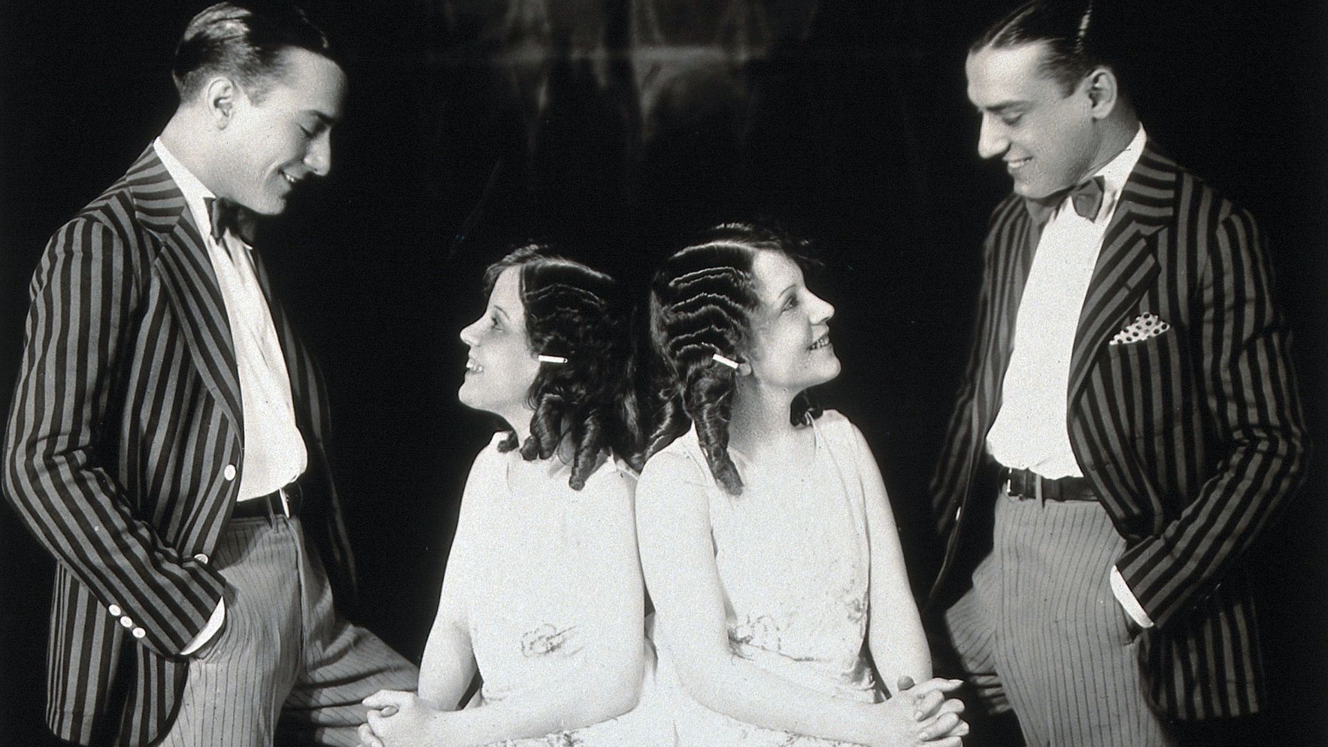 Daisy and Violet Hilton, conjoined twins, being wooed by two young men. Photograph, c. 1927.

Iconographic Collections