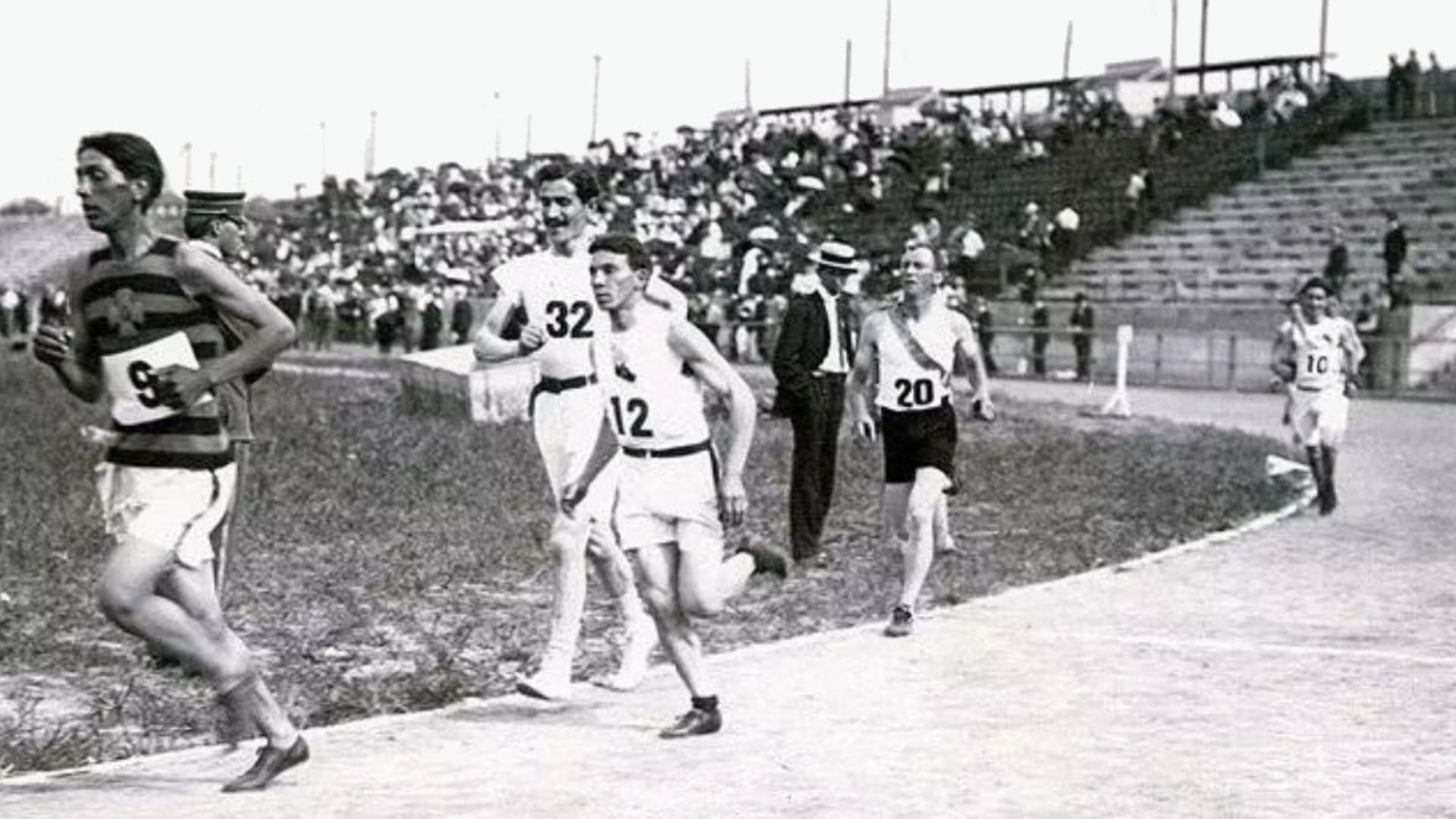Runners circling the stadium track for the first time during the Marathon in the 1904 Olympics during the Louisiana Purchase Exposition: 9 Frank Pierce (USA), 12 Arthur Newton (USA, bronze, some sources by error state it should be Michael Spring), 32 Khar