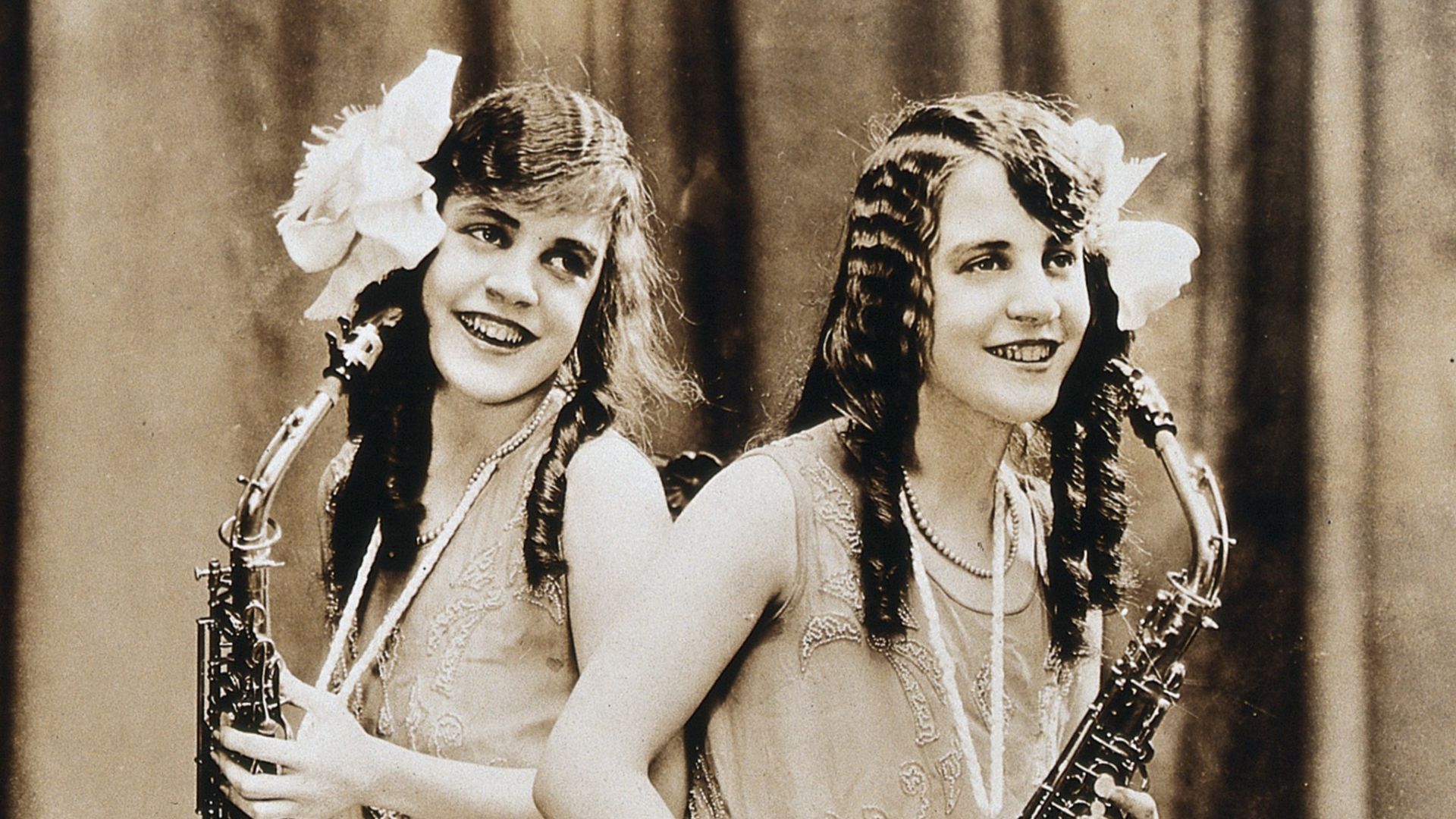 Daisy and Violet Hilton, conjoined twins, with saxophones. Photograph, c. 1927.

Iconographic Collections