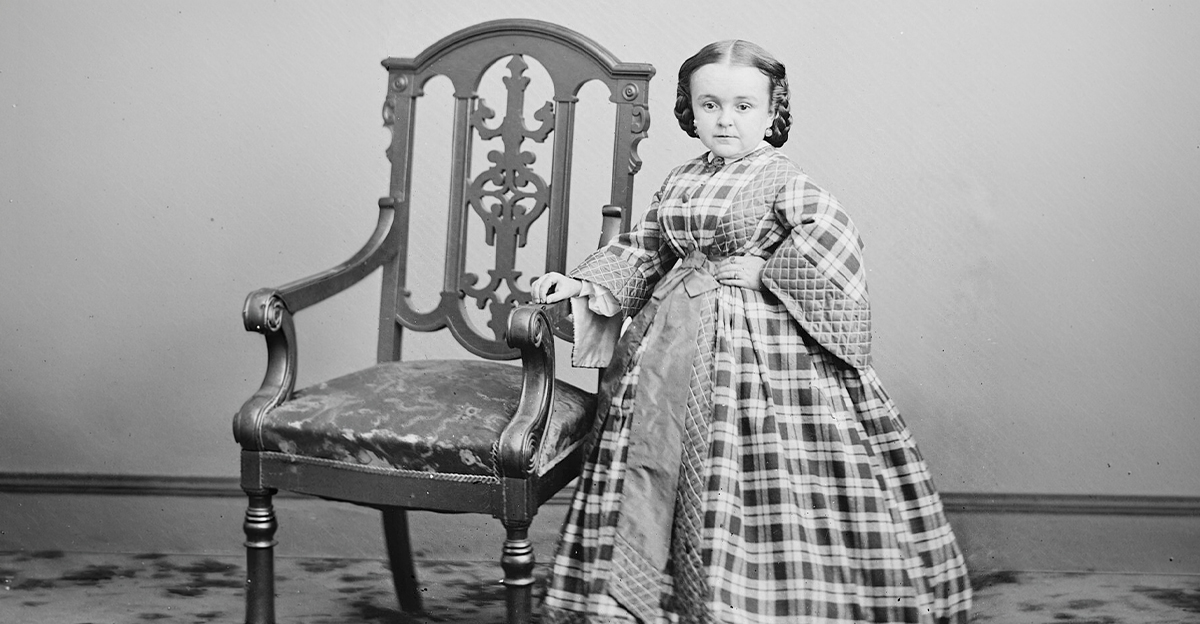 Lavinia Warren standing beside a chair