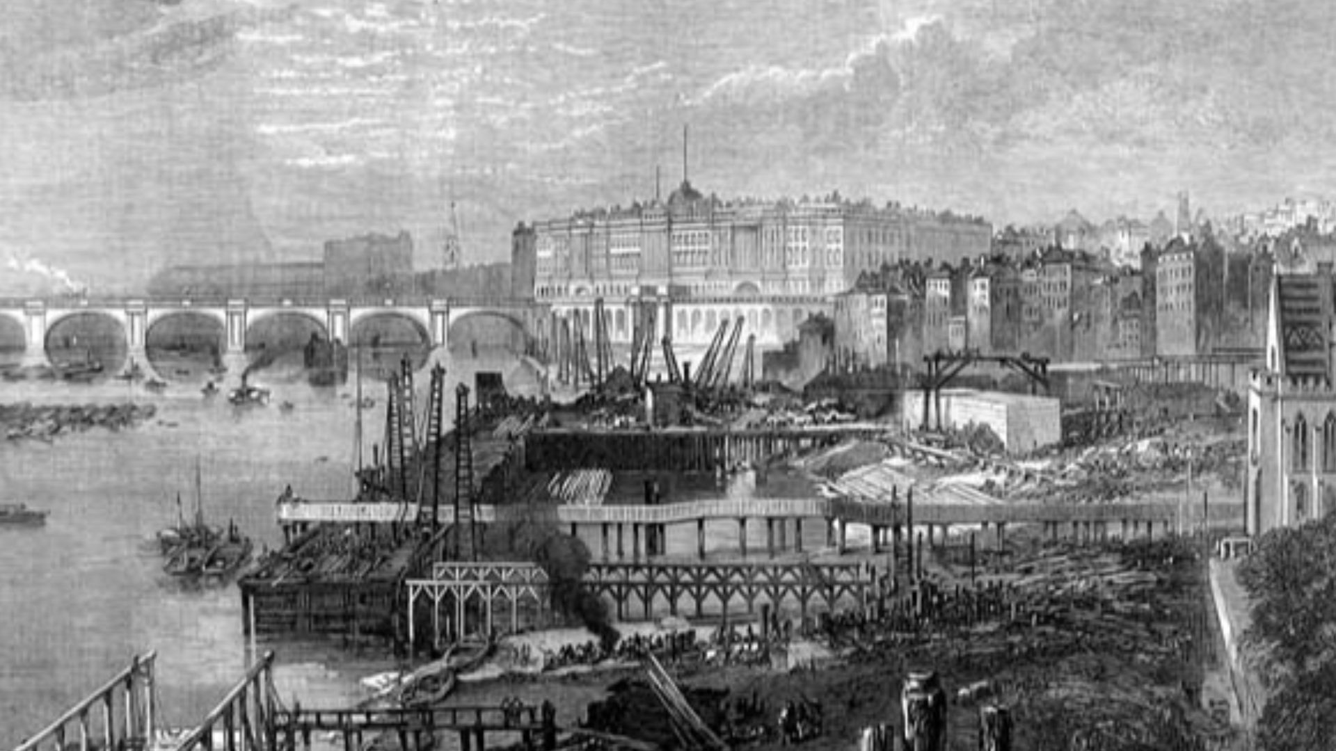 The construction of the Victoria Embankment in London, England. This section in the foreground is near the Inner Temple and the Middle Temple. Somerset House is in the background. The bridge is the old version of Waterloo Bridge.
