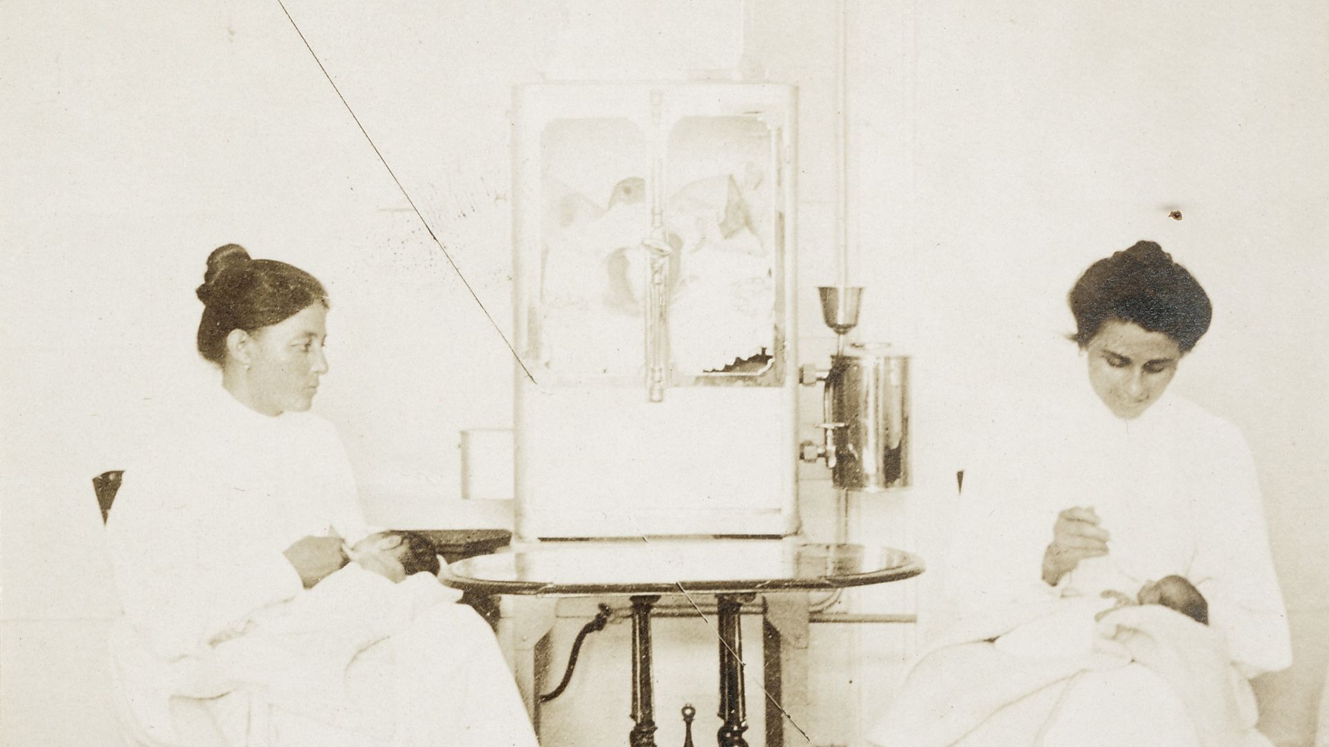 File:Two nurses feeding premature babies in the Baby Incubator exhibit on the Pike at the 1904 World's Fair. Incubator holding two other infants on the table between them. (Detail, Top R - DPLA - 2329801d07eb80fb342b677442e43b5d.jpg