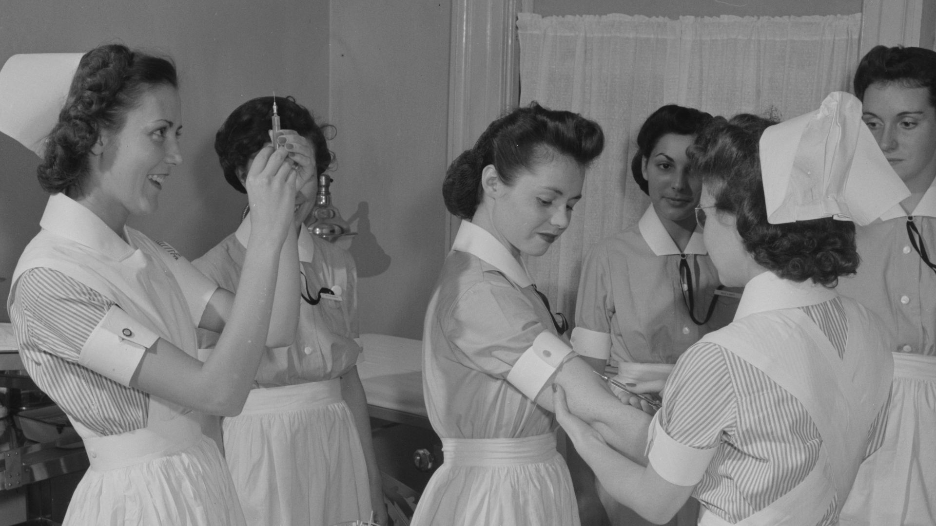 Title: Nurse training. With migration of large numbers of people to new communities, epidemics are a latent possiblity. In New York City's School of Nursing Residence, advanced students give the Schick and Dick test (for Diphtheria and Scarlet Fever, resp