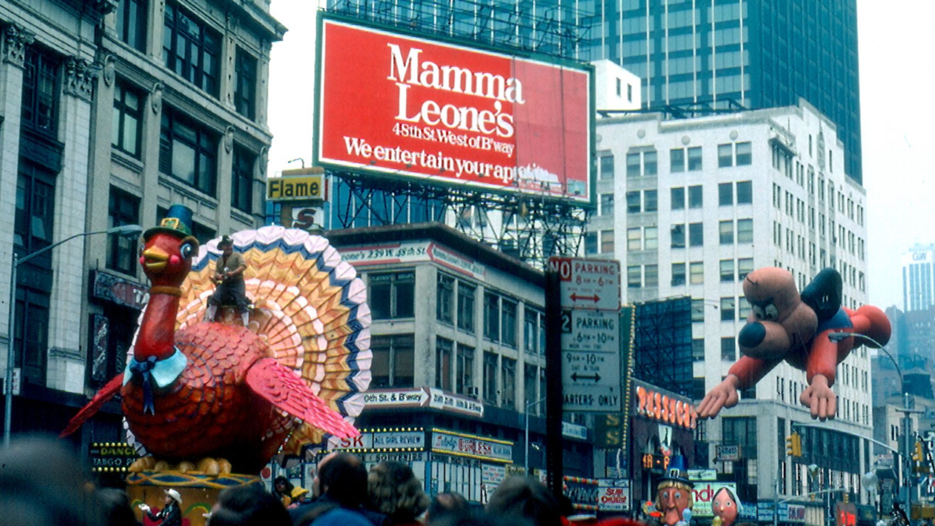 Macy's Thanksgiving Day Parade looking North from the East side of  Broadway between 47th & 48th Streets, 1979.

Bob Keeshan rides the Tom Turkey float as the Underdog balloon follows.