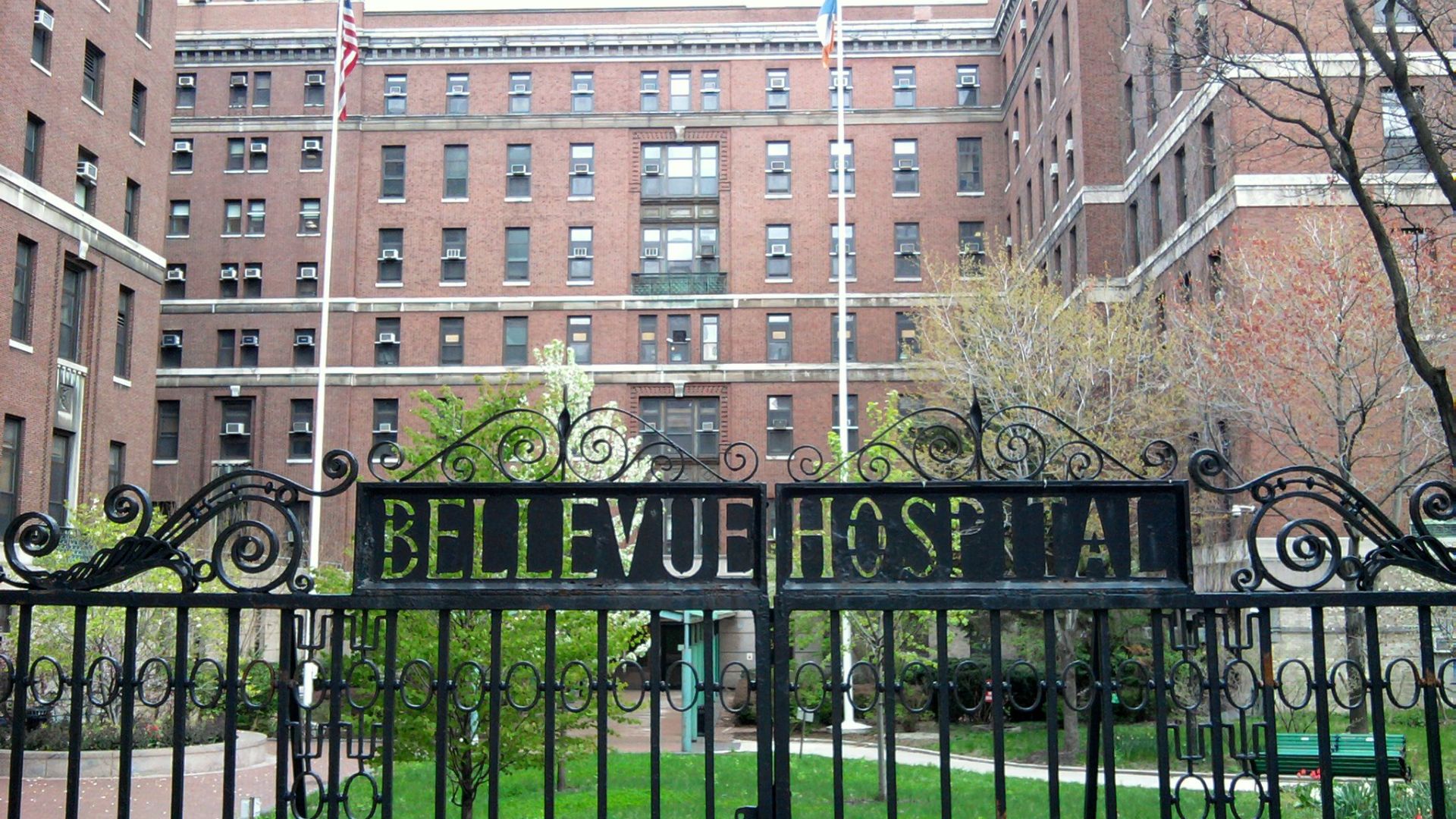 Looking east at old Bellevue front gate on a cloudy day.