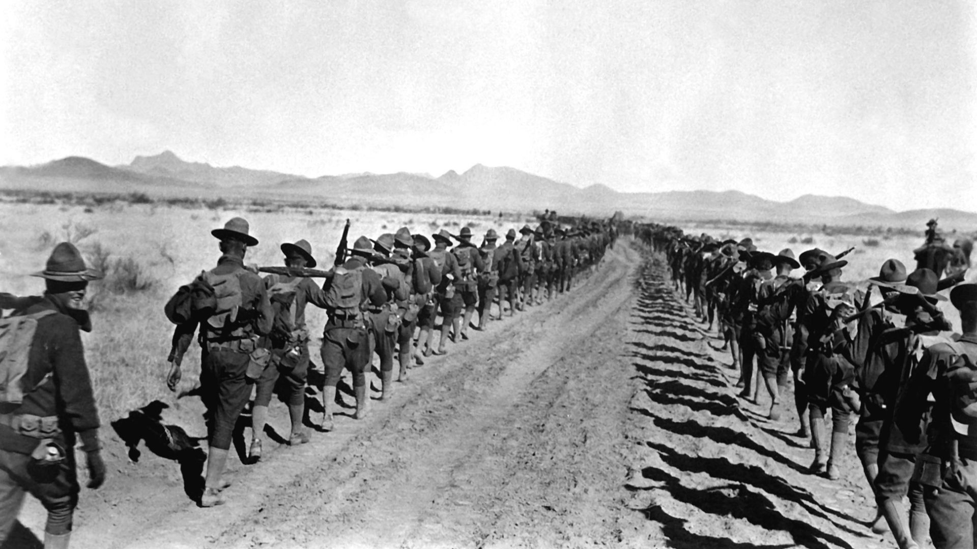 Pancho Villa Expedition. Column of 6th and 16th Infantry, en route to the States, between Corralitos Rancho and Ojo Federico, Jan 29th, 1917. Co. A, 16th Infty. in foreground. This was the longest hike of the return march, 28 miles.