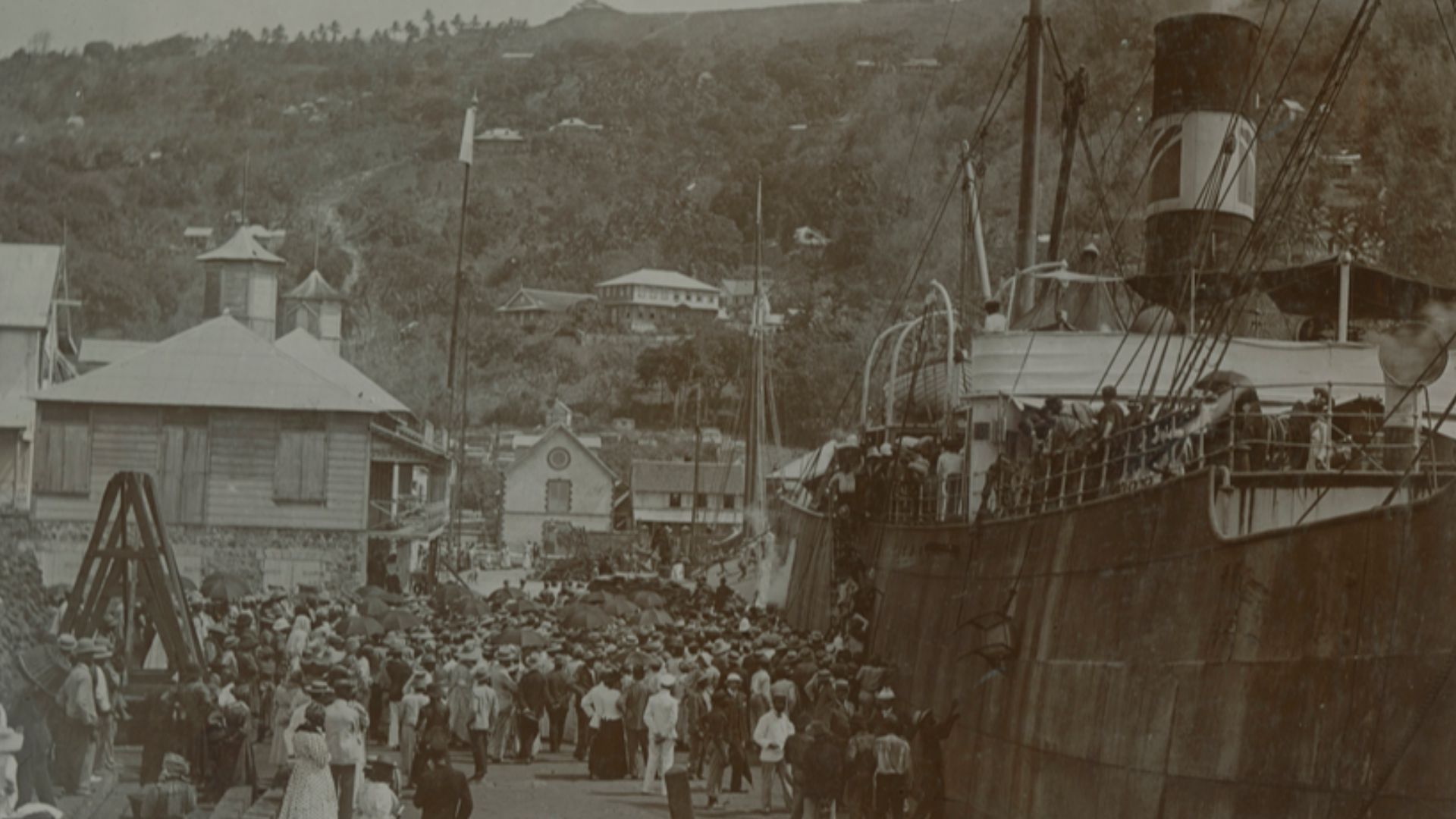Title: Landing of refugees at St. Lucia.
Creator: Cooper, W. G.
Date: 1902
Part Of: Mt. Pelee volcano, St. Pierre, Martinique
Description: Photograph from album that includes views of Martinique and destruction, dead, and rubble from the eruption of the M