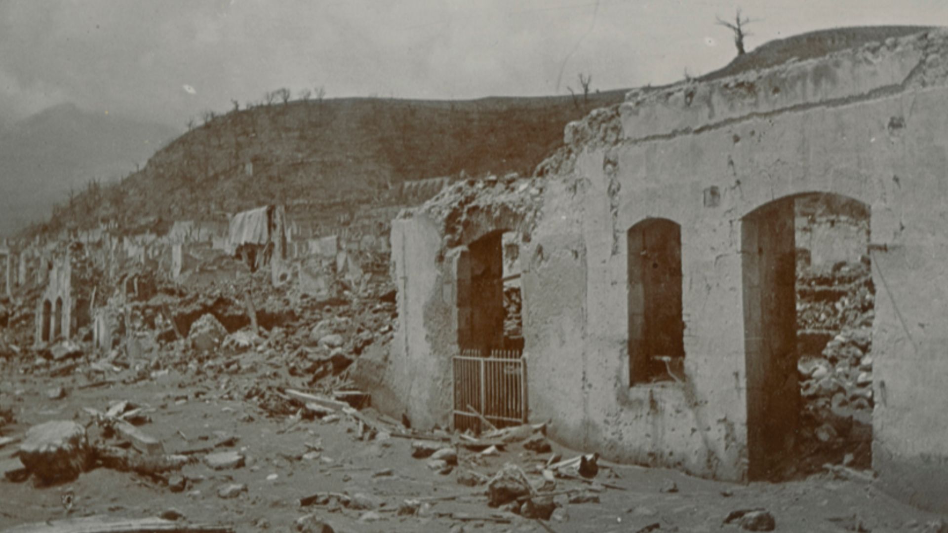 Title: [View of buildings and rubble in St. Pierre, Martinique, after eruption of Mt. Pelee]
Creator: Cooper, W.G.
Date: 1902
Part Of: Mt. Pelee volcano, St. Pierre, Martinique
Description: Photograph from album that includes views of Martinique and destr