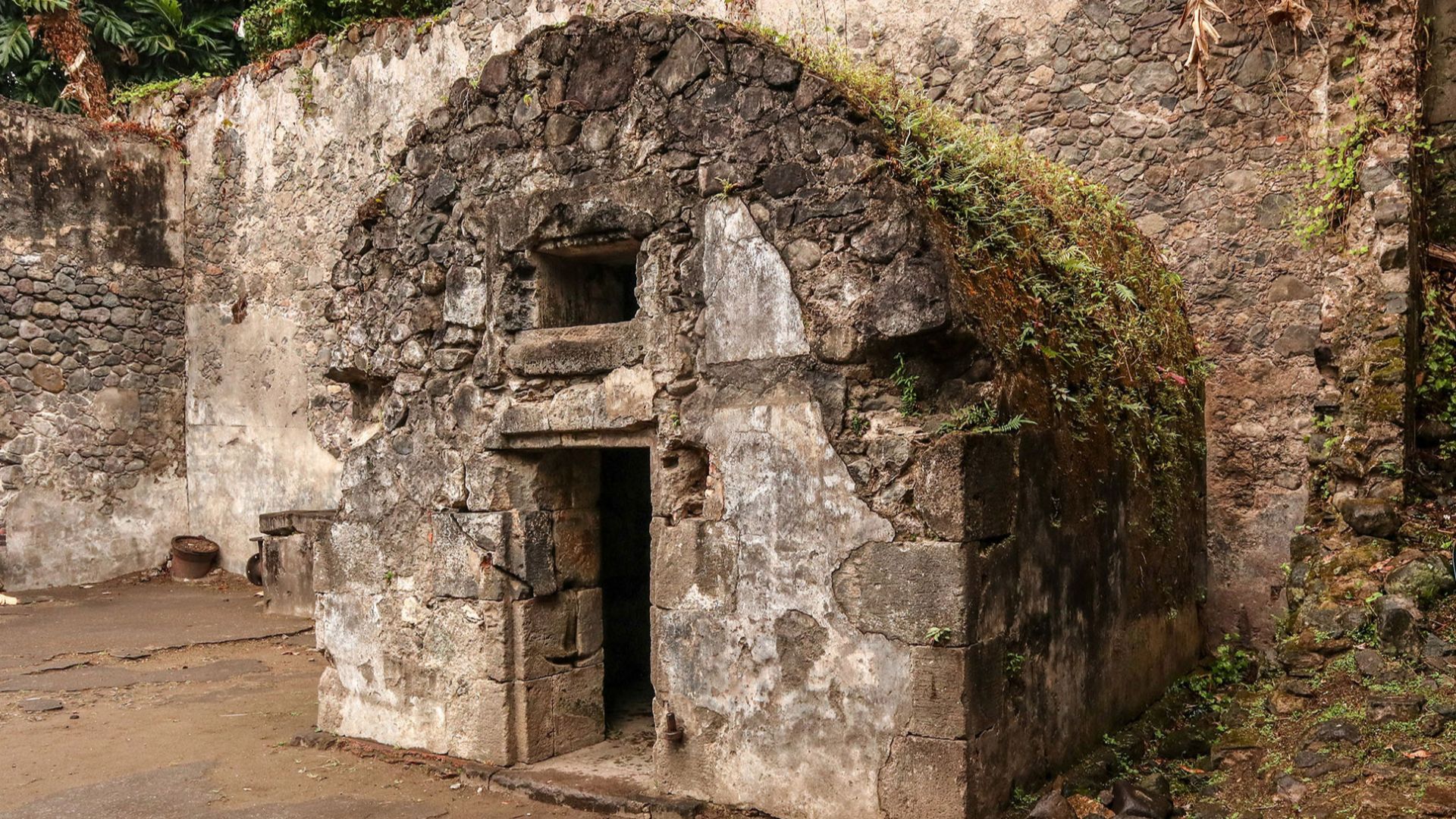 The cell is notable for being a separate building, probably in the cellarof the main prison. Note there are technically no windows, but it appears the original door covered both openings.