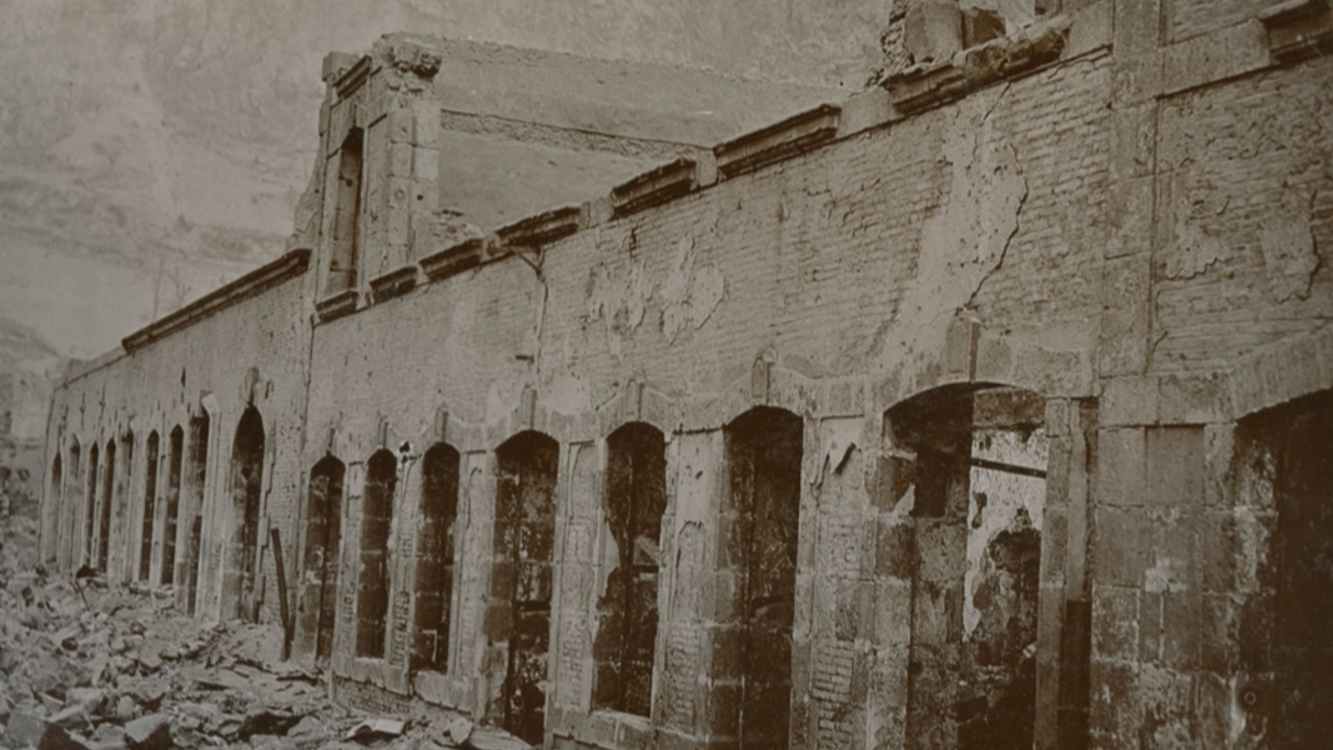 Title: [View of buildings and rubble in St. Pierre, Martinique, after eruption of Mt. Pelee]
Creator: Cooper, W.G.
Date: 1902
Part Of: Mt. Pelee volcano, St. Pierre, Martinique
Description: Photograph from album that includes views of Martinique and destr