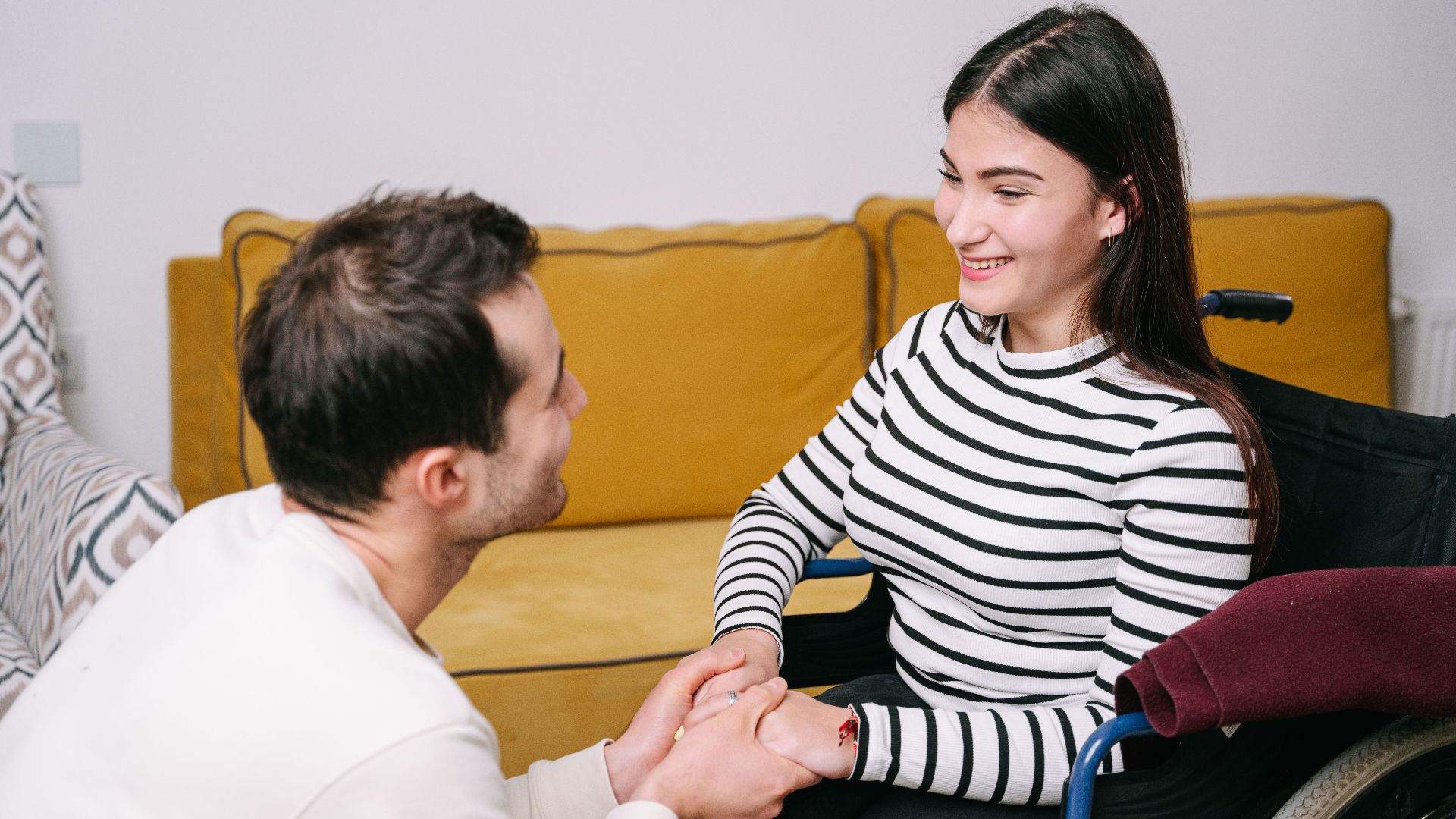 Happy couple sharing a warm moment of care and comfort indoors.