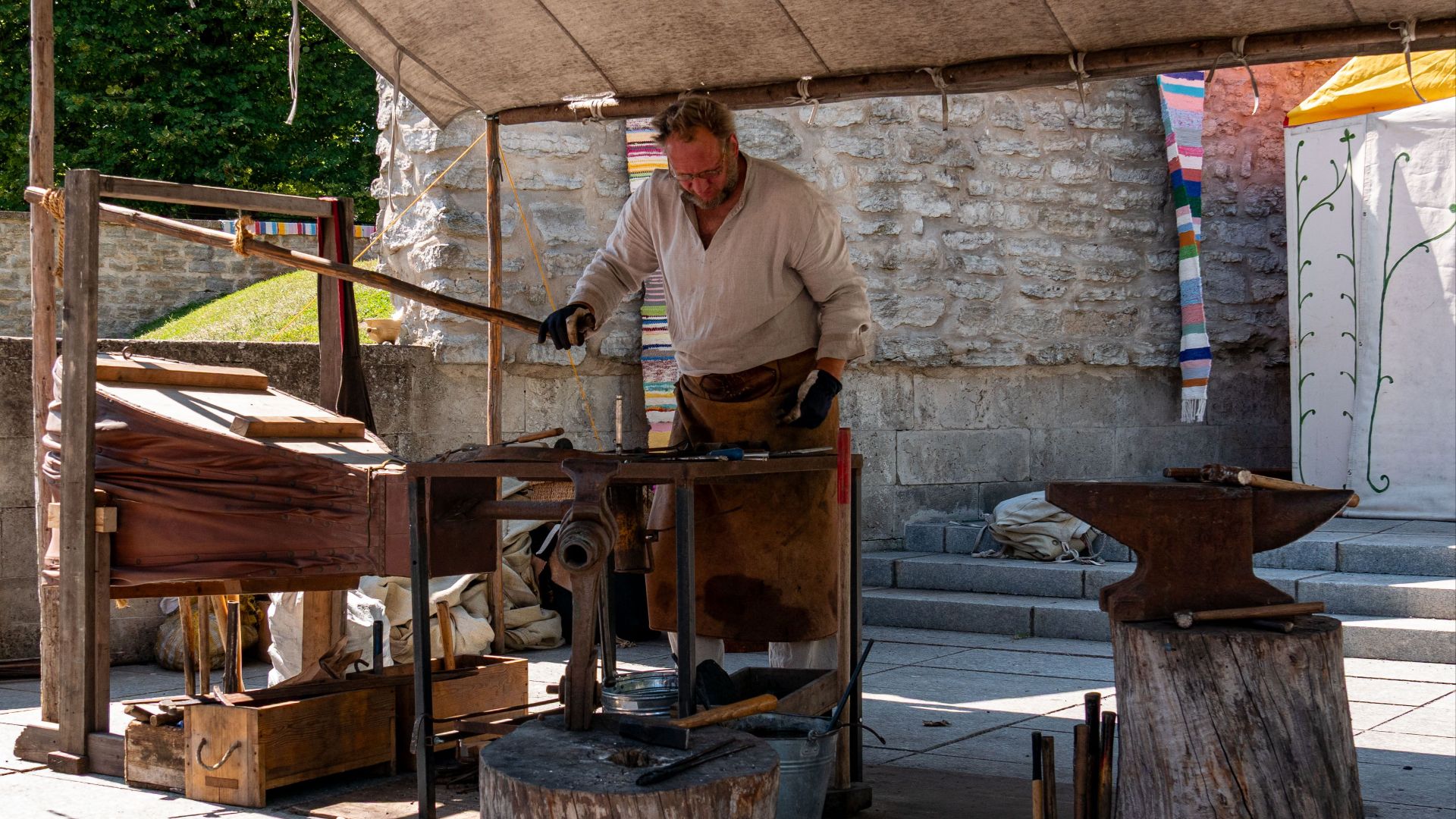 A blacksmith works at a medieval festival in Tallinn, Estonia.