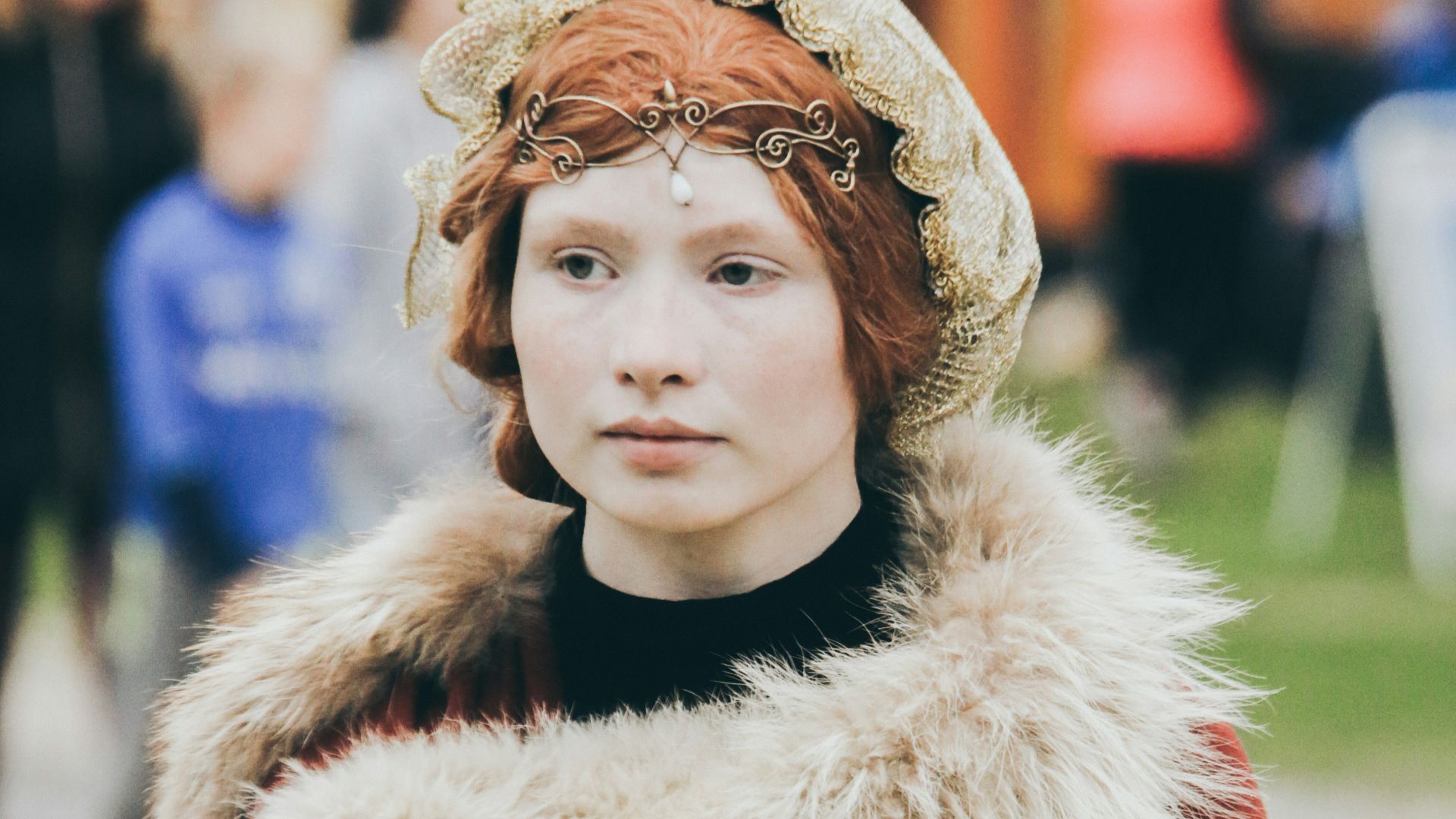 woman wearing red and white fur coat