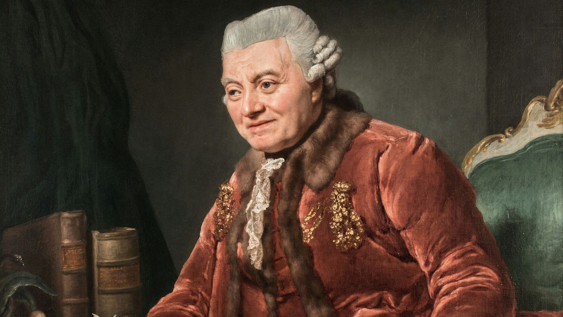 A man in historical attire writing at a desk.