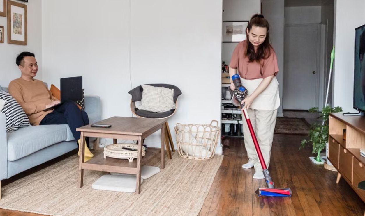 woman vacuuming the living room