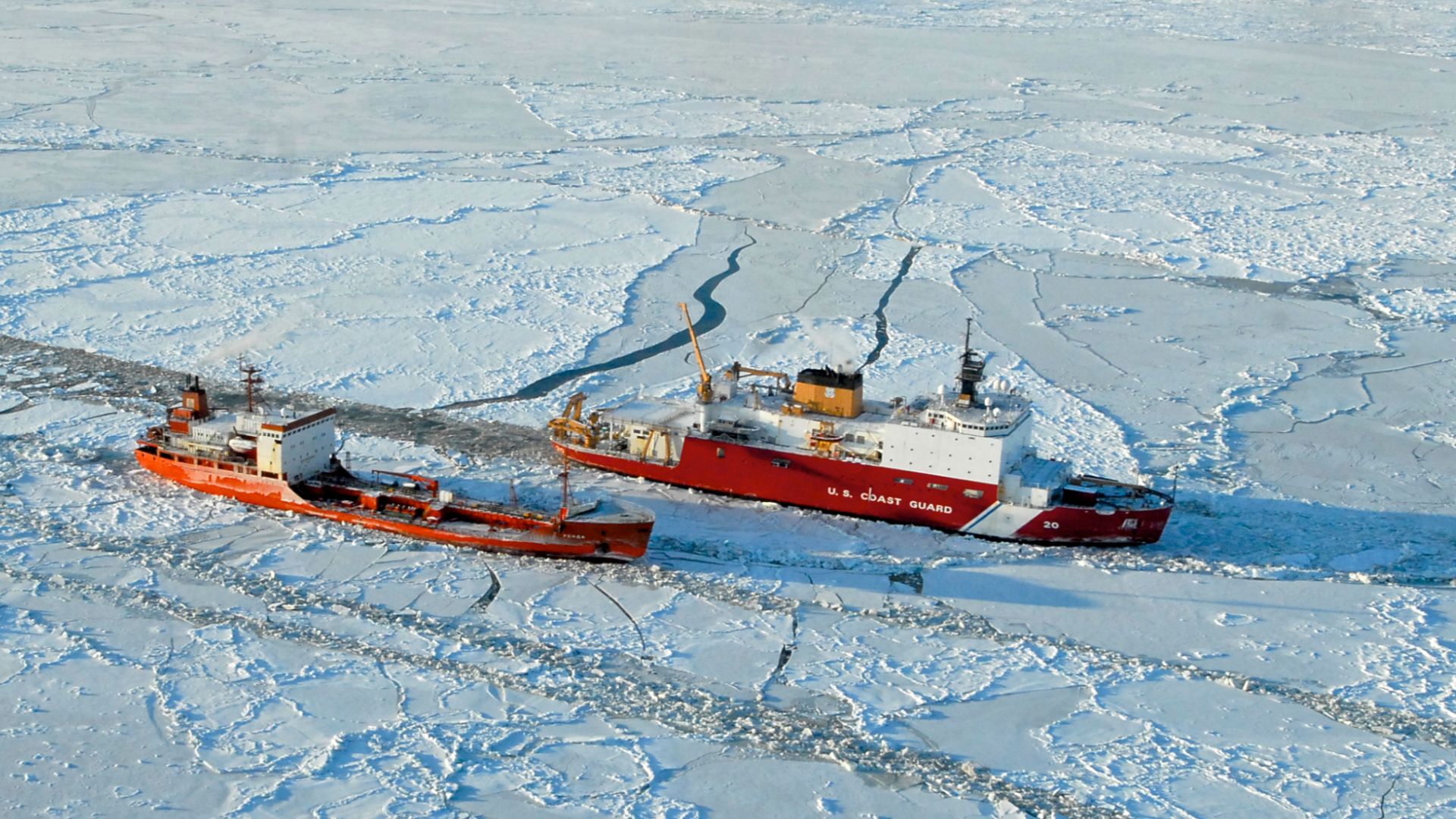 The USCG Healy (WAGB-20) breaks ice around the Russian-flagged tanker Renda 250 miles south of Nome, Alaska,  Jan. 6, 2012. The Healy is the Coast Guard's only currently operating polar icebreaker. (DoD photo by Petty Officer 1st Class Sara Francis, U.S. 