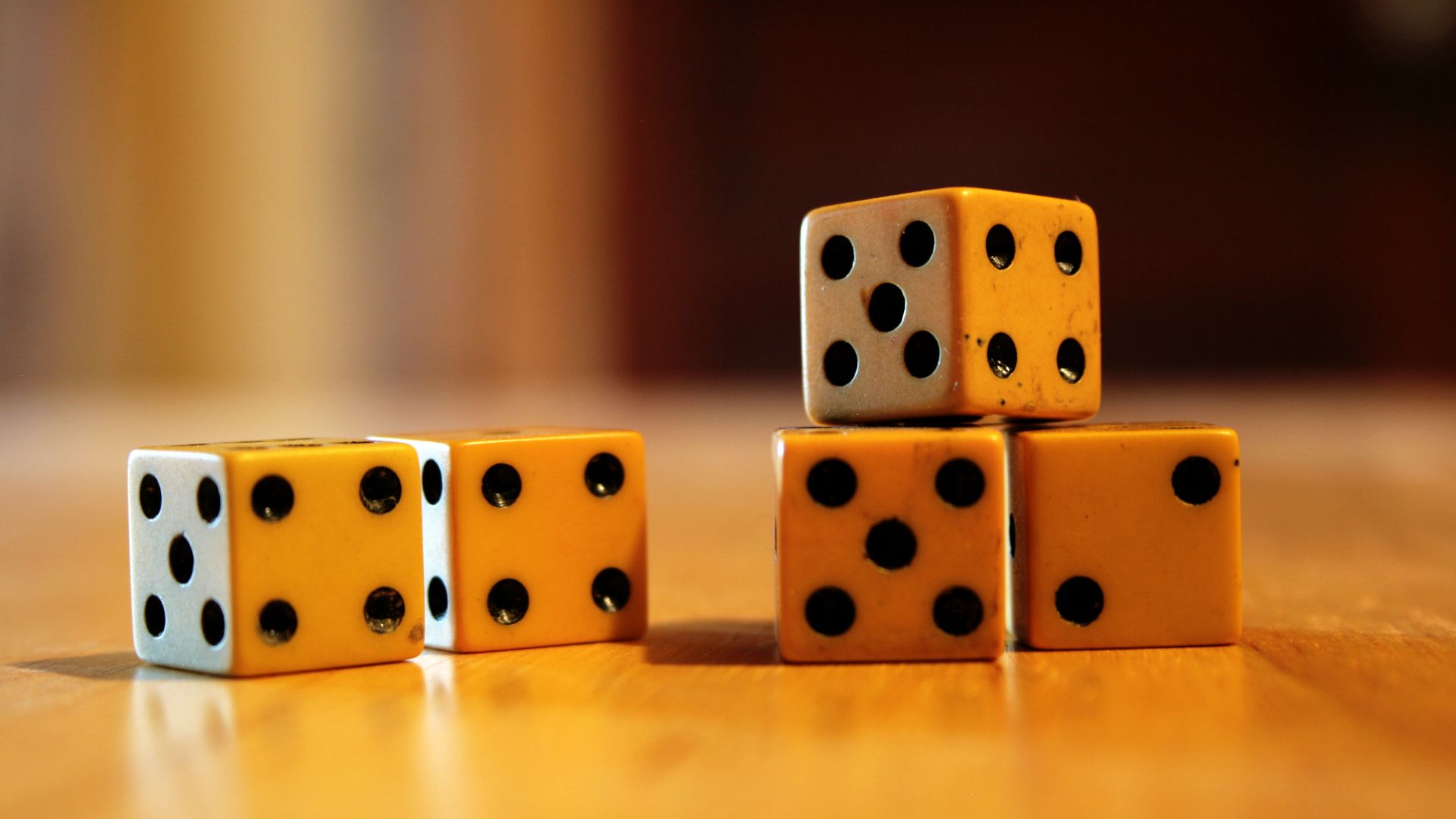 Five ivory dice.