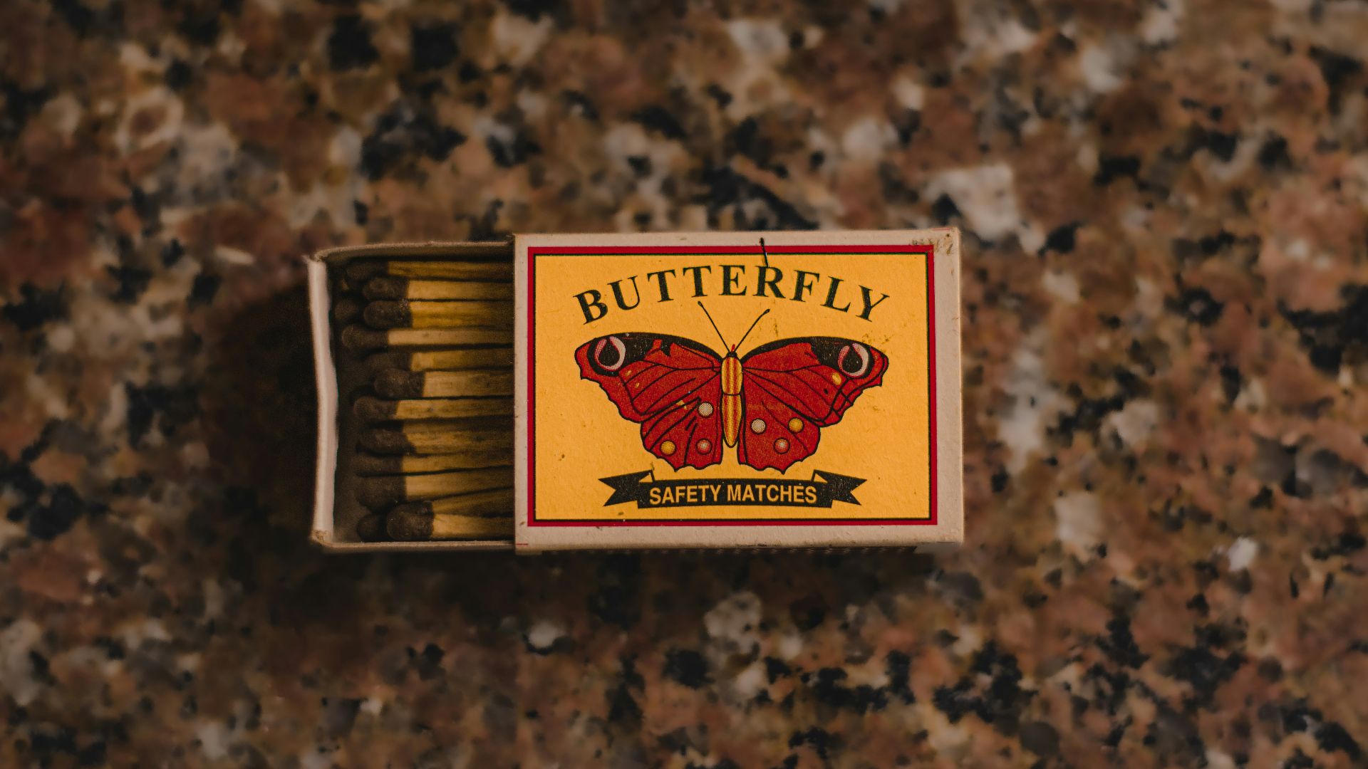 a box of butterfly cigarettes sitting on top of a counter