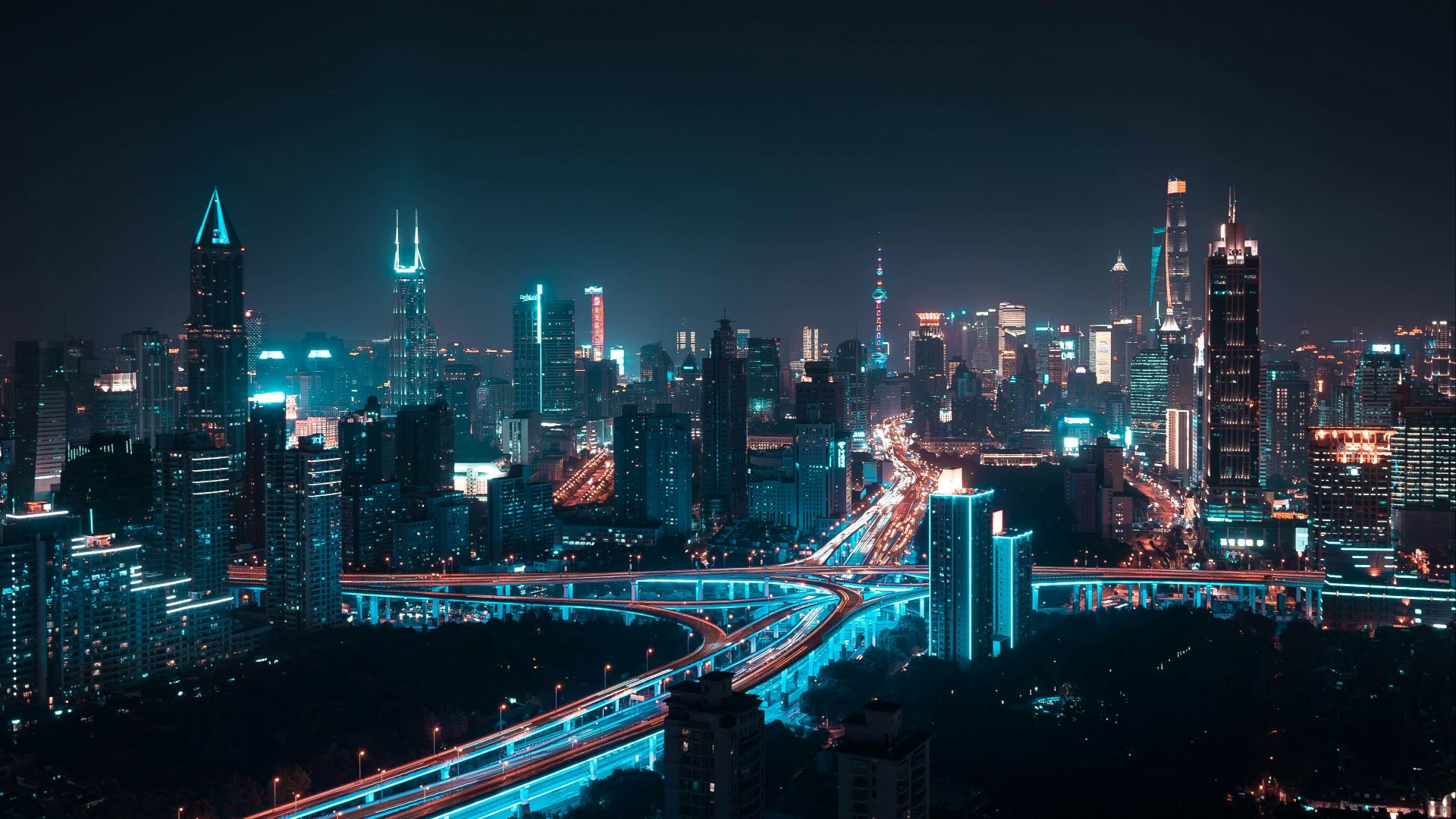 aerial photography of lightened city buildings at night time