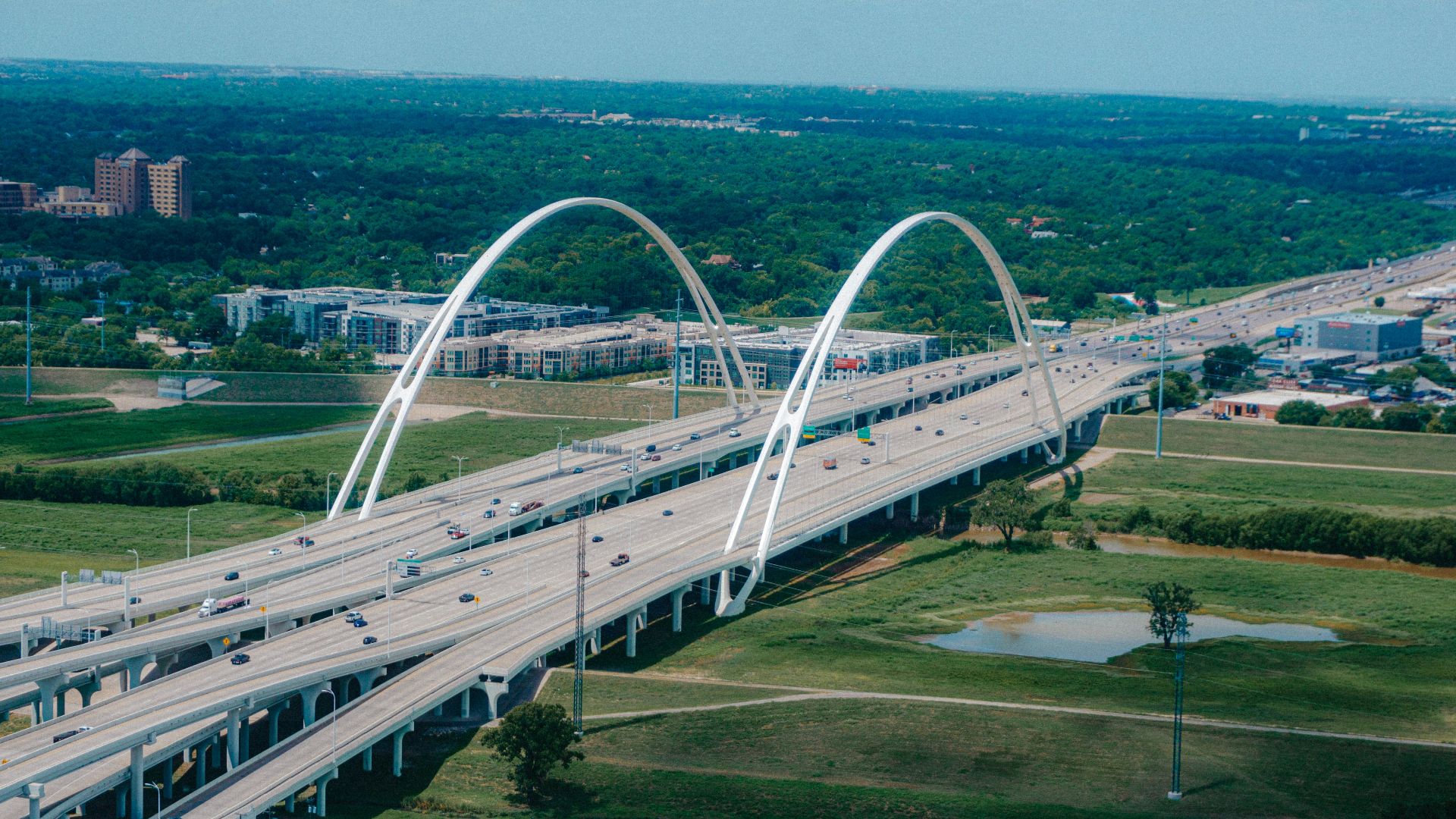 Modern bridge with arches over a highway