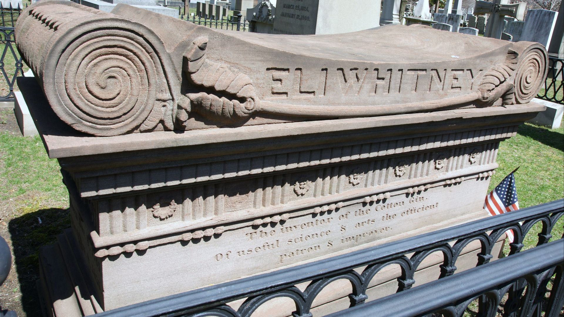 South side of monument at Eli Whitney grave in Grove Street Cemetery, New Haven, Connecticut. The monument is up against iron fences on the south and west sides of the family plot, necessitating an angled view to see the inscription. Inscription on this s