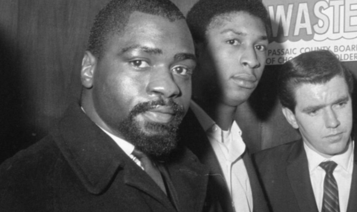 Former middleweight boxer Rubin ‘Hurricane' Carter (left) and John Artis are shown during their arraignment Dec. 16 at the county courthouse here on charges of murder and assault with intent to kill. They are accused of having killed three people at a bar on June 17th.