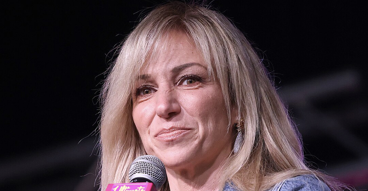 Debbie Gibson speaking with an attendee at the 2025 Arizona Ultimate Women's Expo at the Phoenix Convention Center in Phoenix, Arizona.