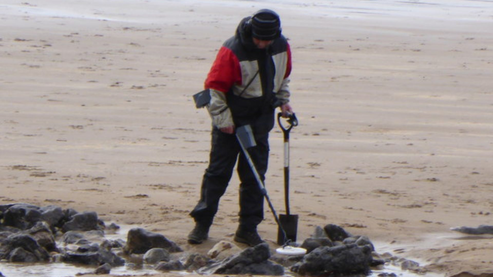 Metal detectorist on Langland Bay March 2014