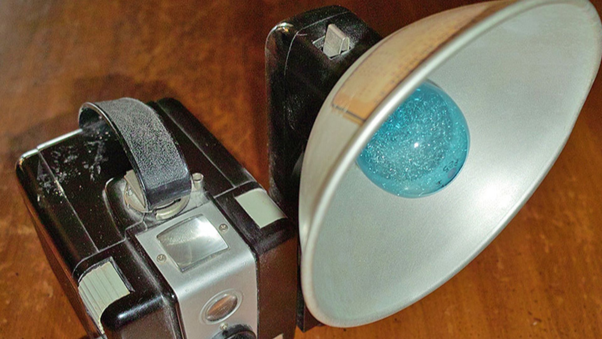 A Kodak Brownie Hawkeye camera with Kodalite flash attachment and Sylvania blue-dot daylight-type flash bulb P25.