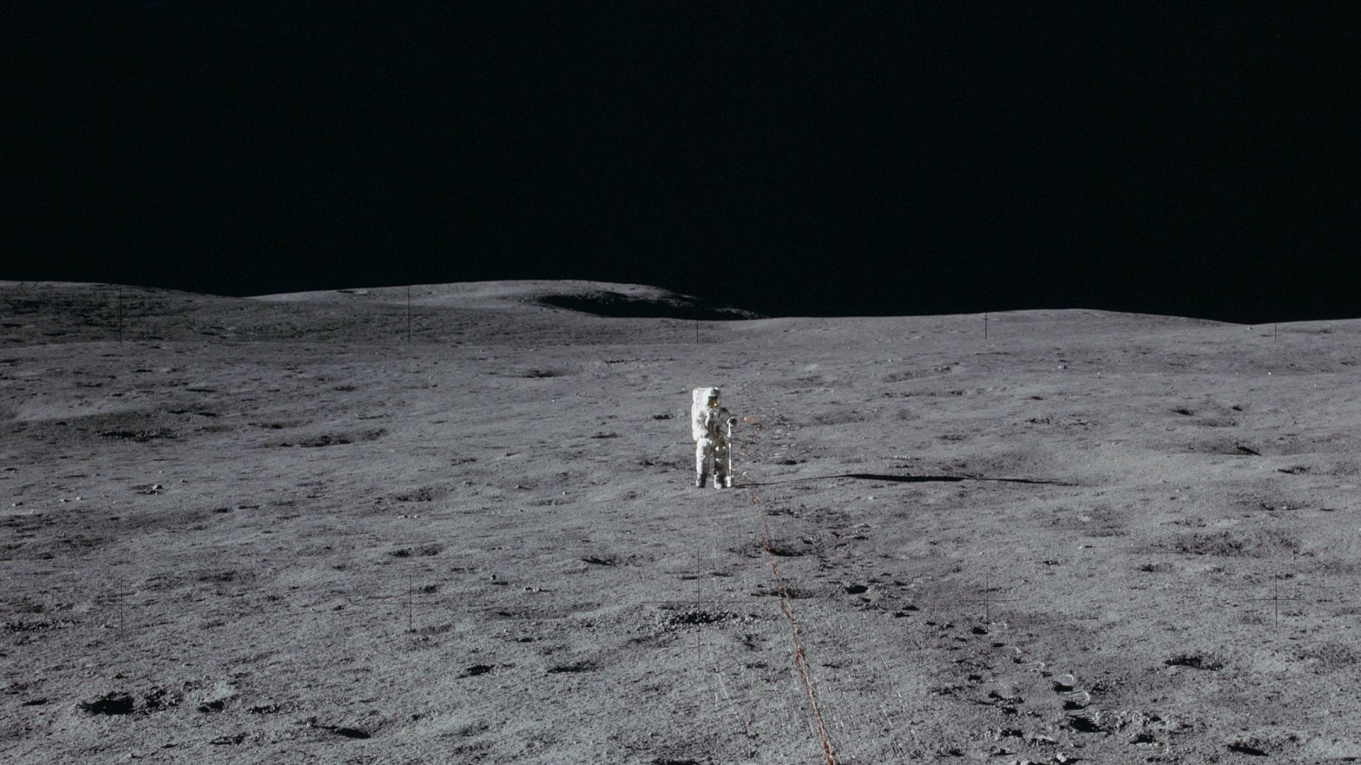 Lunar Module Pilot Edgar Mitchell lays out the geophone line on Apollo 14.