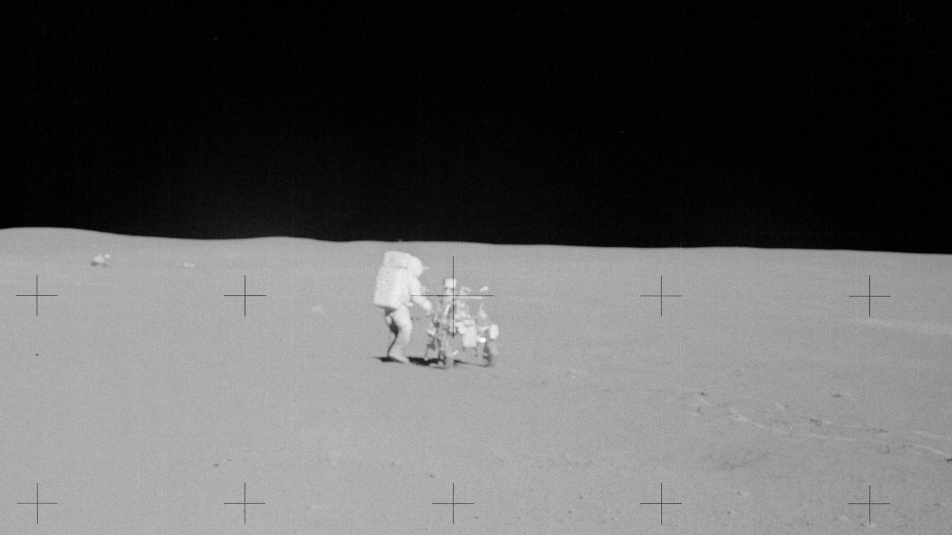 AS14-64-9140 (6 Feb. 1971) --- Astronaut Edgar D. Mitchell, lunar module pilot, participates in the mission's second extravehicular activity (EVA). He is standing near the modularized equipment transporter (MET). While astronauts Alan B. Shepard Jr., comm