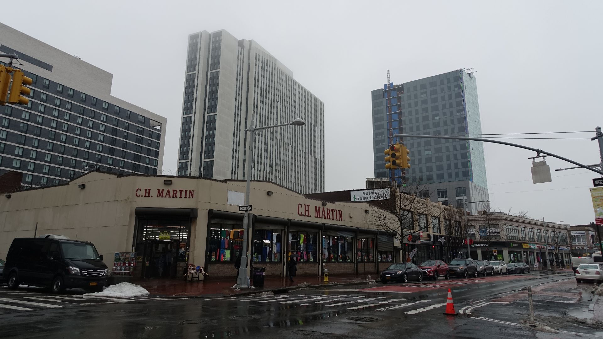 Looking south Tower I of The Crossing at Jamaica Station complex (left) and the Jamaica Hampton Inn & Suites hotel (right) on Archer Avenue, looking from Jamaica Avenue and 149th Street in Jamaica, Queens. The towers are part of the growing Jamaica skylin