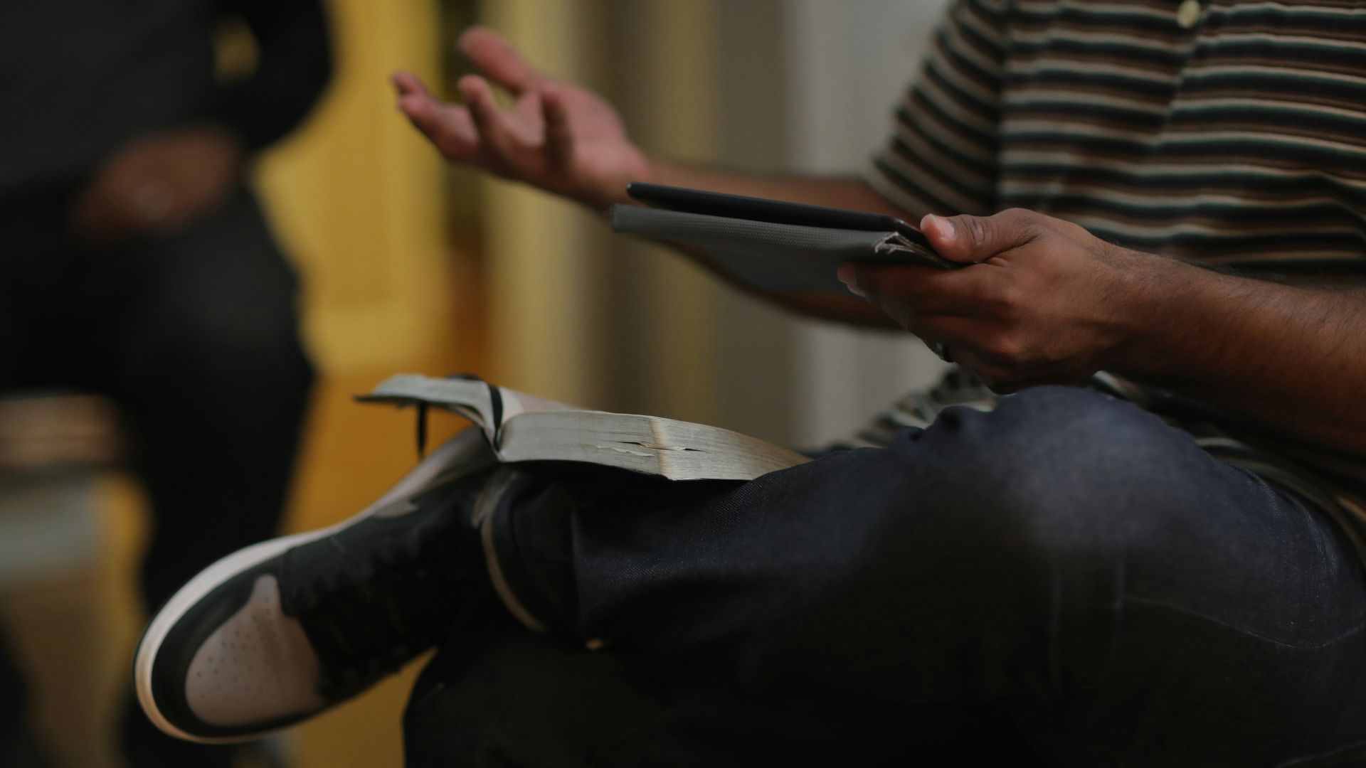 a person lying on the ground with a phone in their hand