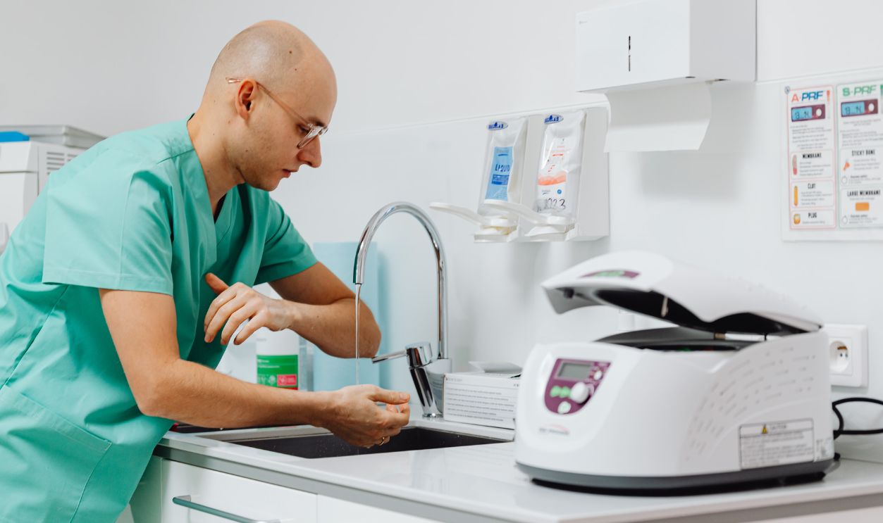 A medical professional practicing hand hygiene in a clinical setting