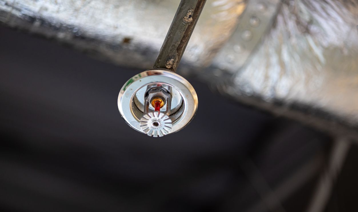 Shutterstock-2745667495, Automatic fire sprinkler head installed on ceiling for fire protection and safety in building