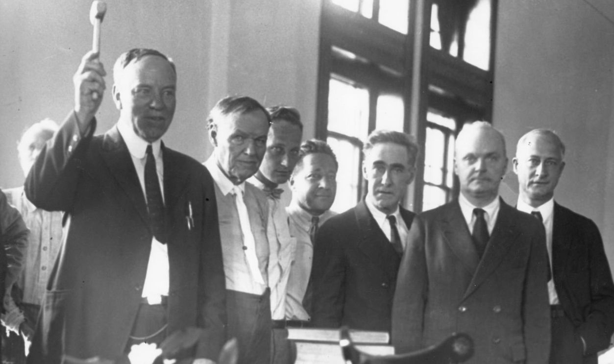A scene from court in the John Scopes trial. Identified in the photo: Clarence Darrow (2nd from left) and John Scopes (3rd from left). A scene from court in the John Scopes trial. Identified in the photo: Clarence Darrow (2nd from left) and John Scopes (3rd from left). 