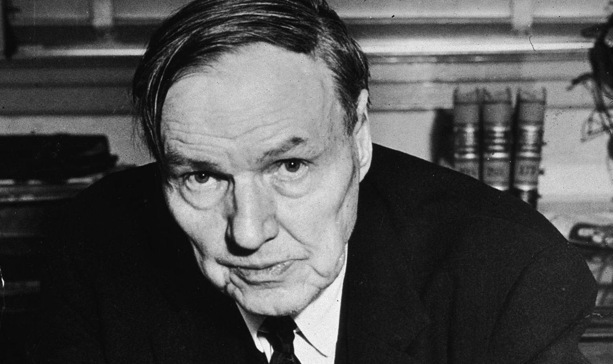 Portrait of American lawyer and Civil Rights activist Clarence Darrow (1857-1938) seated at a desk, circa 1920s. 