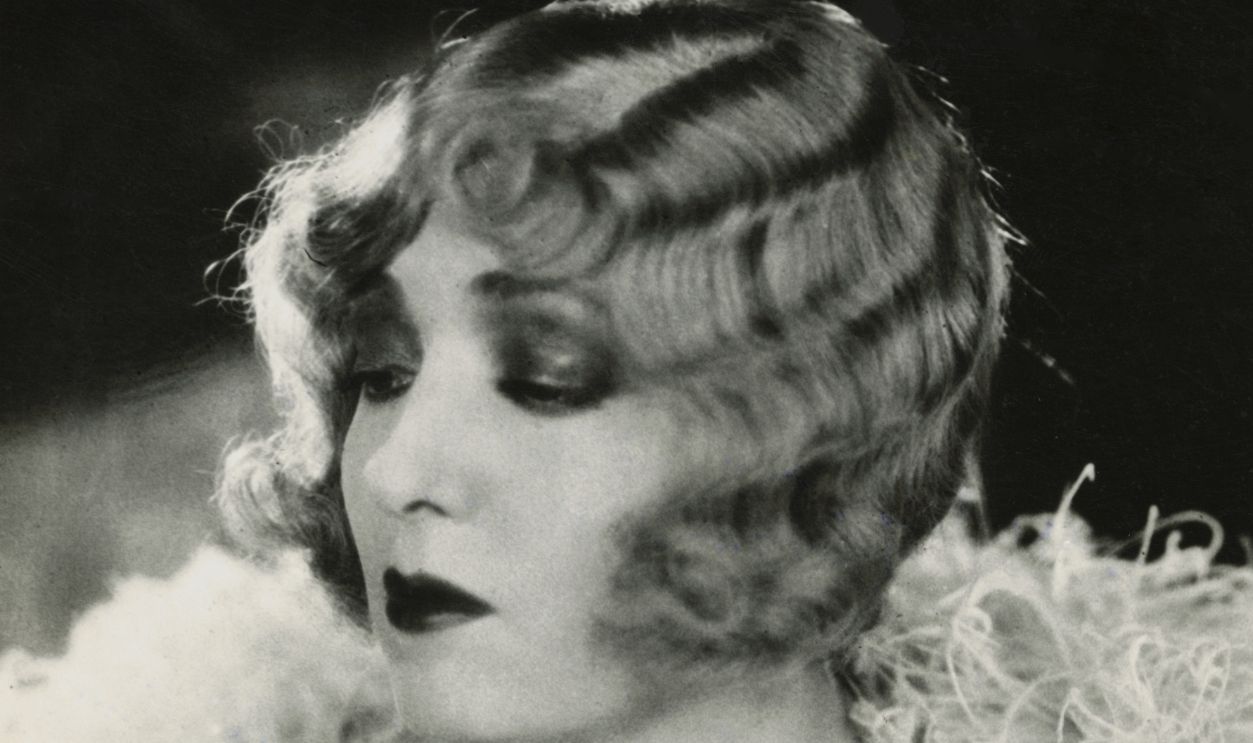 First Picture Of Peggy Joyce In The Movies. Here is the first picture of Peggy Hopkins Joyce in her new role--that of a movie actress in Hollywood. According to the screen executives, Peggy will be a success as a film star. This picture shows her made up for the part she plays in her first film.