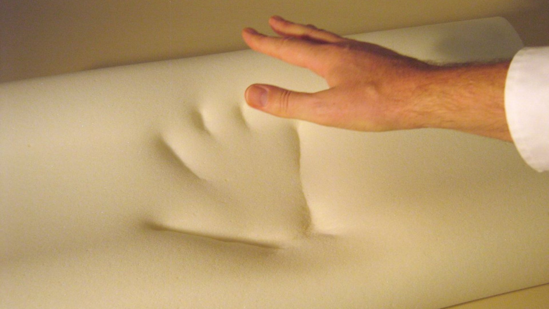 Memory foam. The picture is taken by pressing my hand in the foam and releasing it.