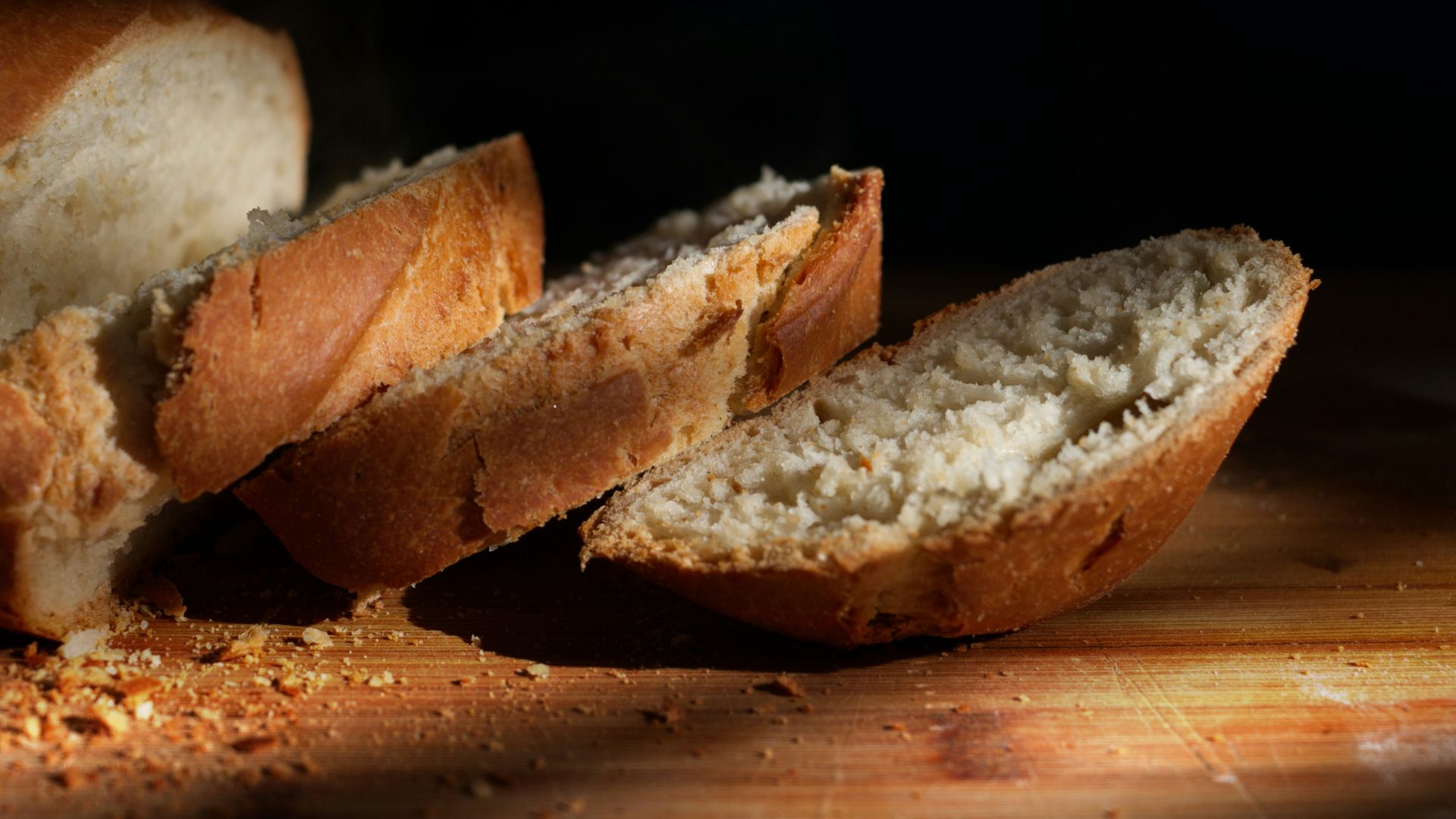 sliced bread on brown wooden table