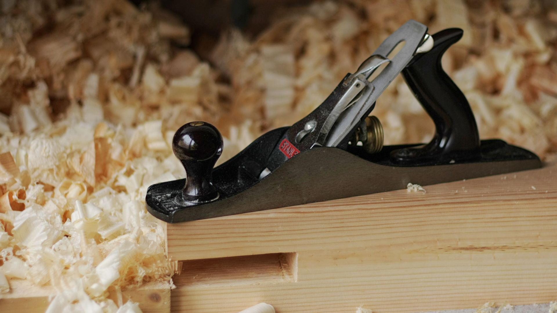 Photo of a Stanley jack plane with wood shavings.