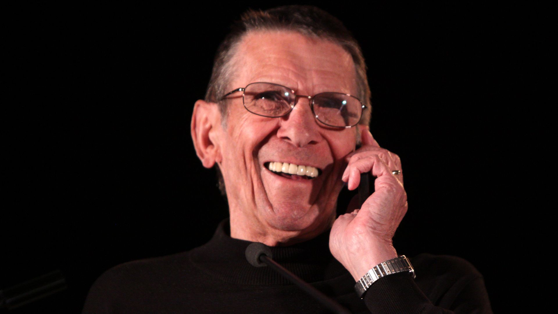 Leonard Nimoy at the Phoenix Comicon in Phoenix, Arizona, answering a phone call from his wife.

Please attribute to Gage Skidmore if used elsewhere.