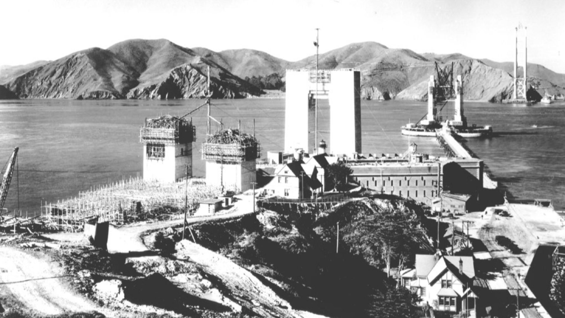The Golden Gate Bridge under construction. Notice how Fort Point has been surrounded by the construction project. All of the lighthouse keepers' residences were ultimately demolished to make way for the bridge on-ramp.